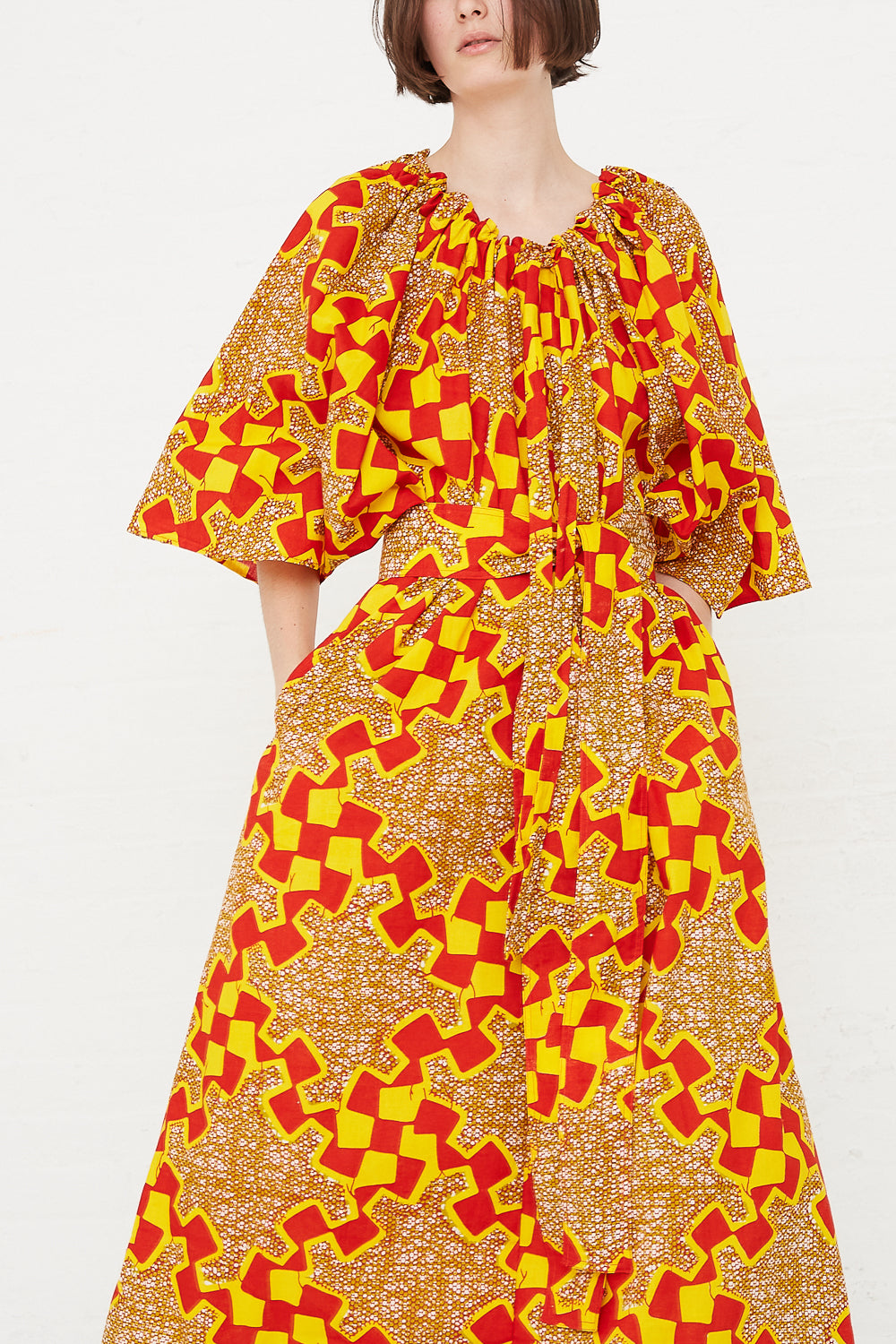 Odile Jacobs - Arielle Dress in Yellow/Red hand in pockets front detail