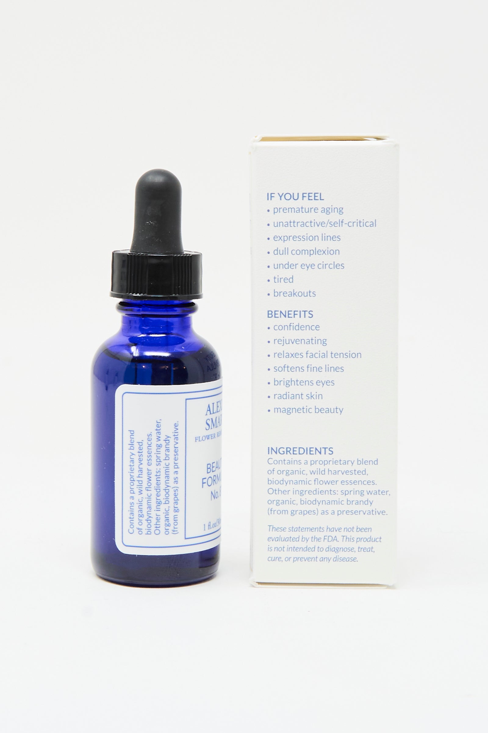 A blue glass dropper bottle of Alexis Smart Flower Remedies - Beauty Formula No. 8 stands next to its box, which highlights benefits, suggested uses, and organic flower essences designed for confidence and radiant skin.