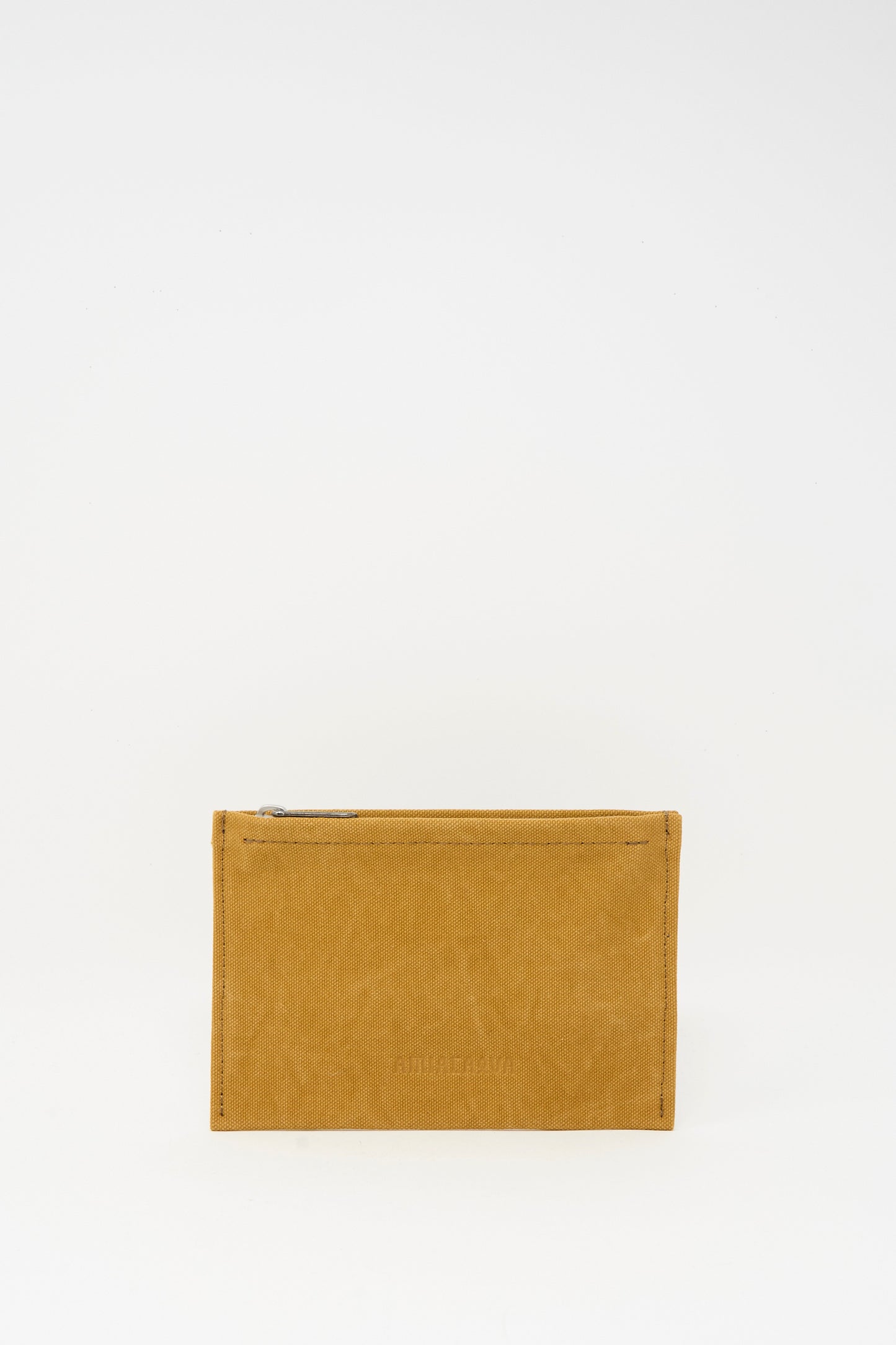 The Amiacalva Washed Canvas Medium Pouch in Mustard is a small, rectangular pouch with a top zipper, shown upright against a plain white background.