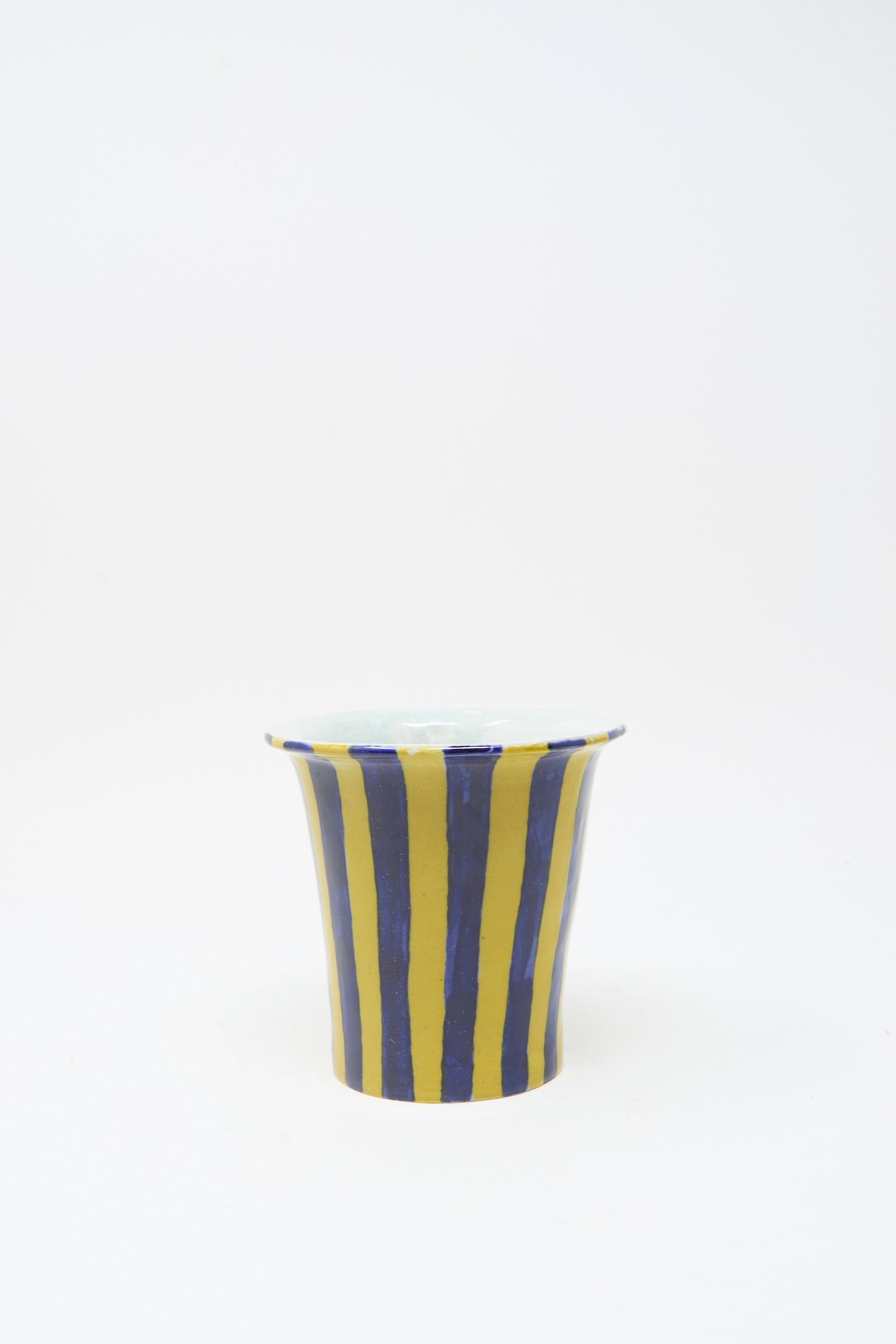 The Ariel Clute Hand Painted Floral Vessel is a handmade ceramic cup, crafted in California and set against a plain white background.