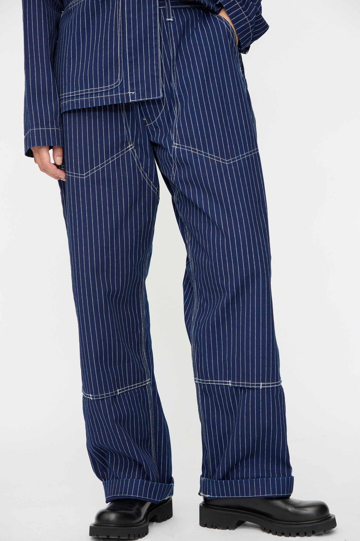 Wearing the As Ever Henri Pant in Wabash with a matching top featuring white stitching, styled with black chunky boots.