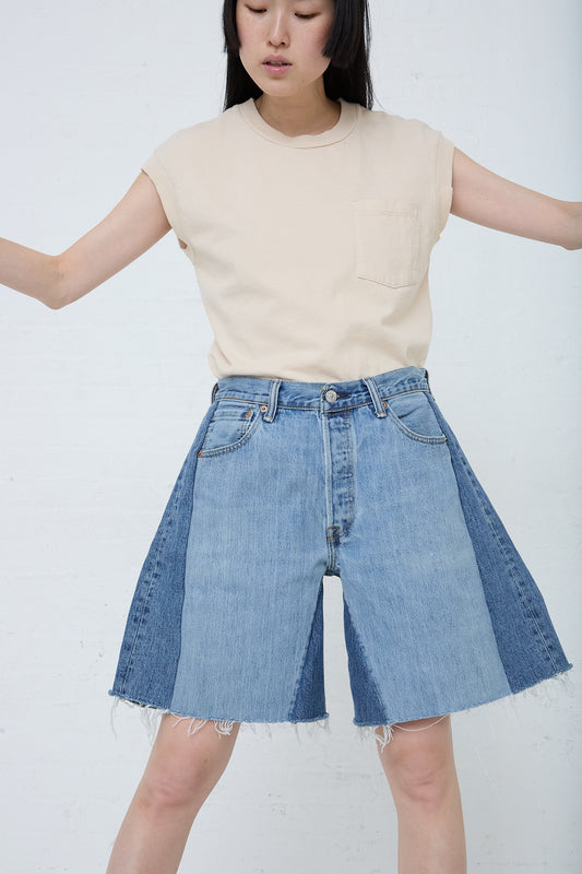 A woman in B Sides' Lasso Short in Vintage Indigo denim. Front view.