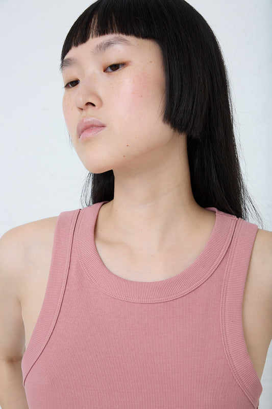 A woman in a slim fit Rib Tank in Zinnia Overdye by B Sides. Front view and up close.