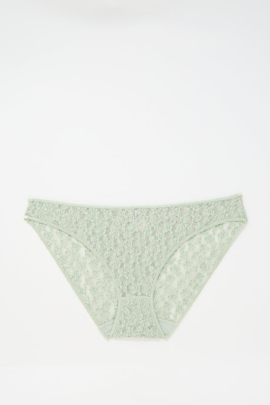 The Baserange Crescent Pants in Conta Green are low-rise bikini briefs made in Portugal, crafted from delicate organic cotton lace and shown on a plain white background.