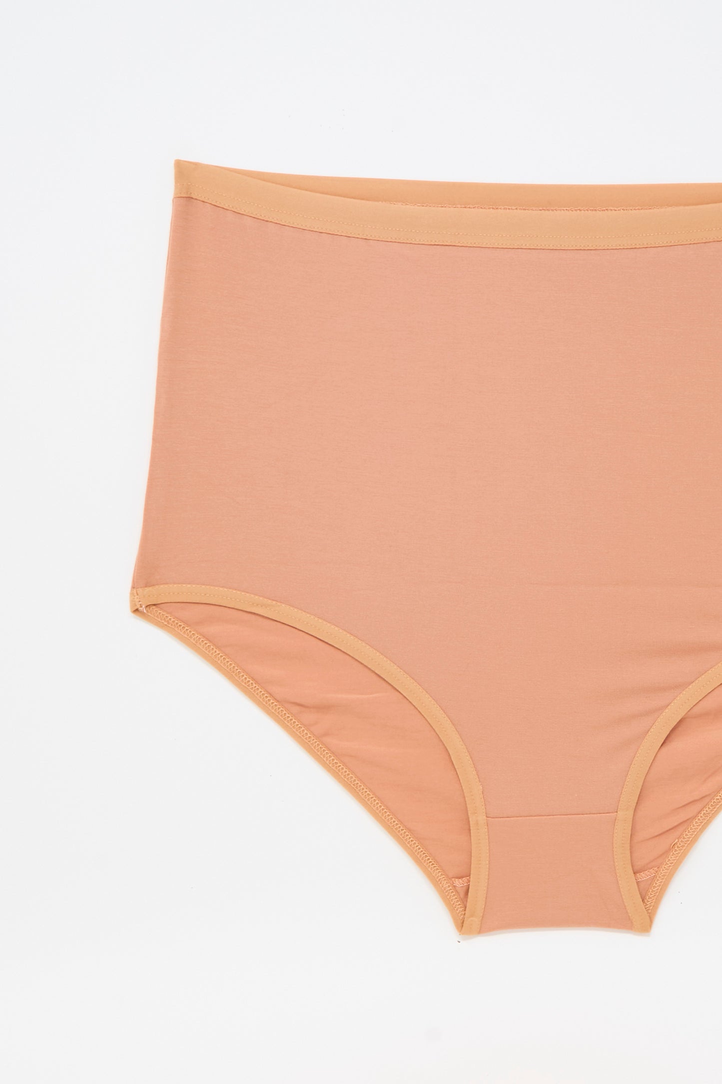 Highwaist Bell Pants in Branch Terracotta by Baserange, women's bamboo lyocell underwear, laid flat on a white background.