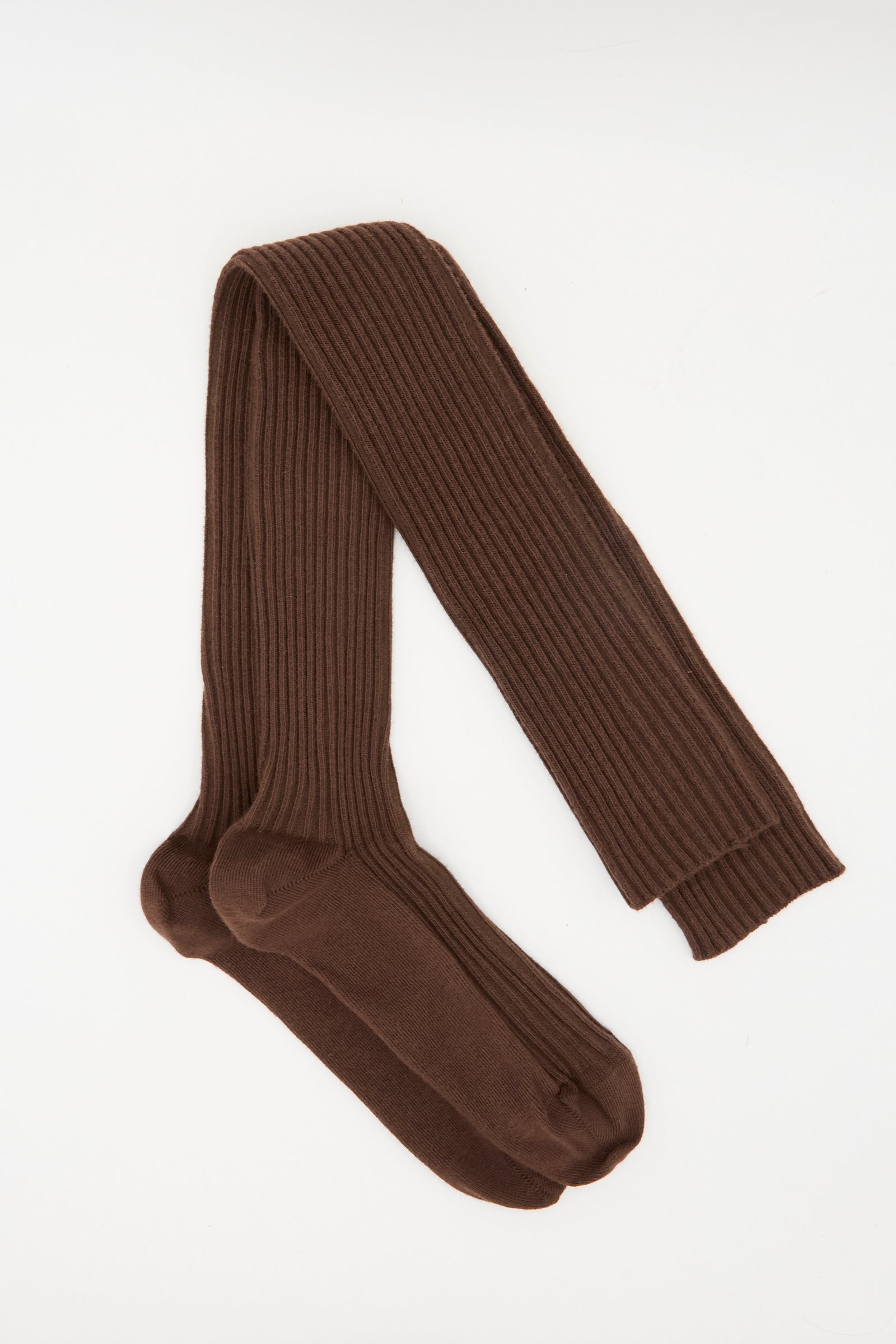 A pair of Baserange Overknee Socks in Orta Brown, made in France, shown laid flat on a white background.