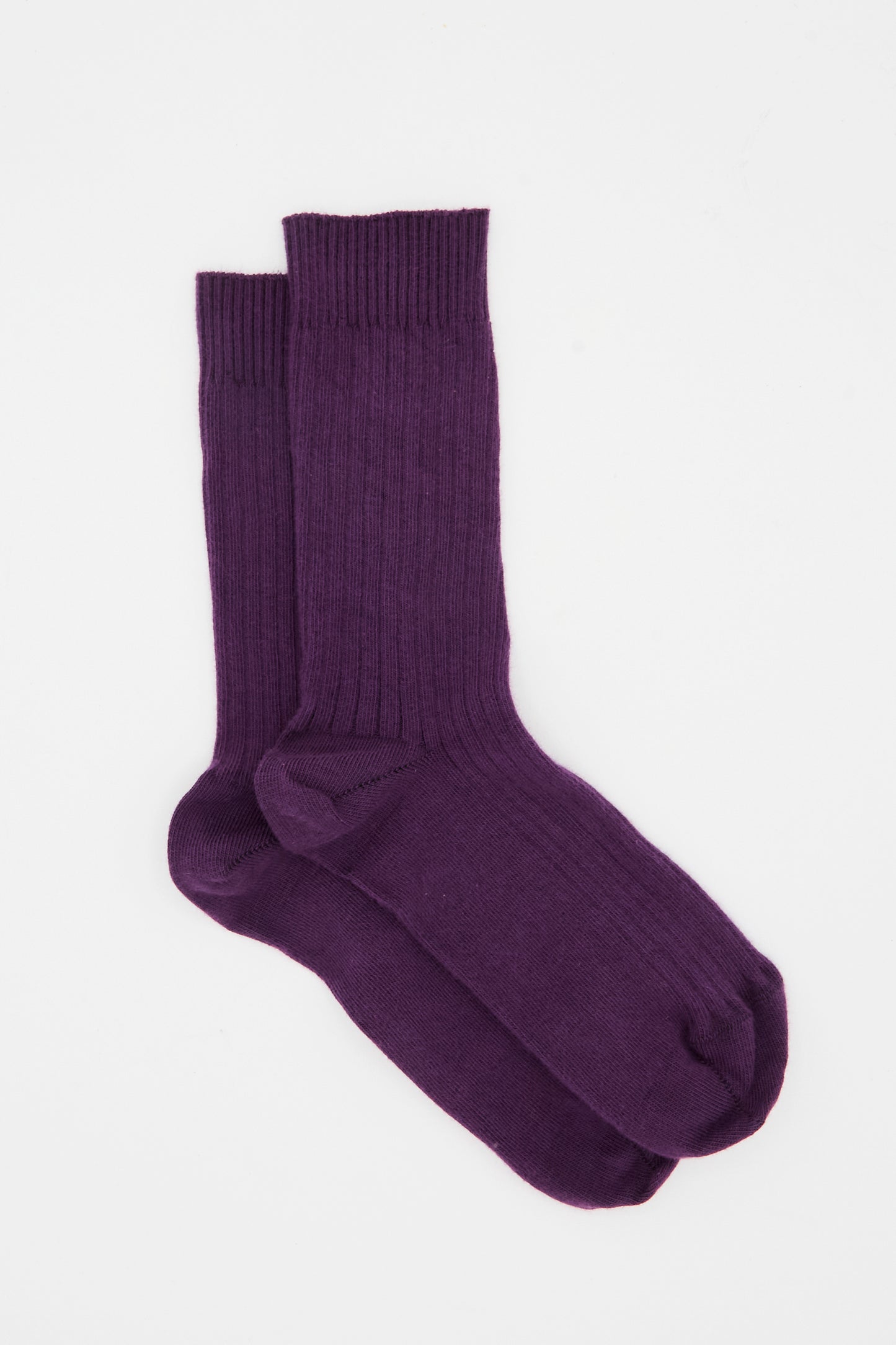 The Baserange Rib Overankle Sock in Gesso Purple, made from organic cotton, is shown laid flat on a white background.