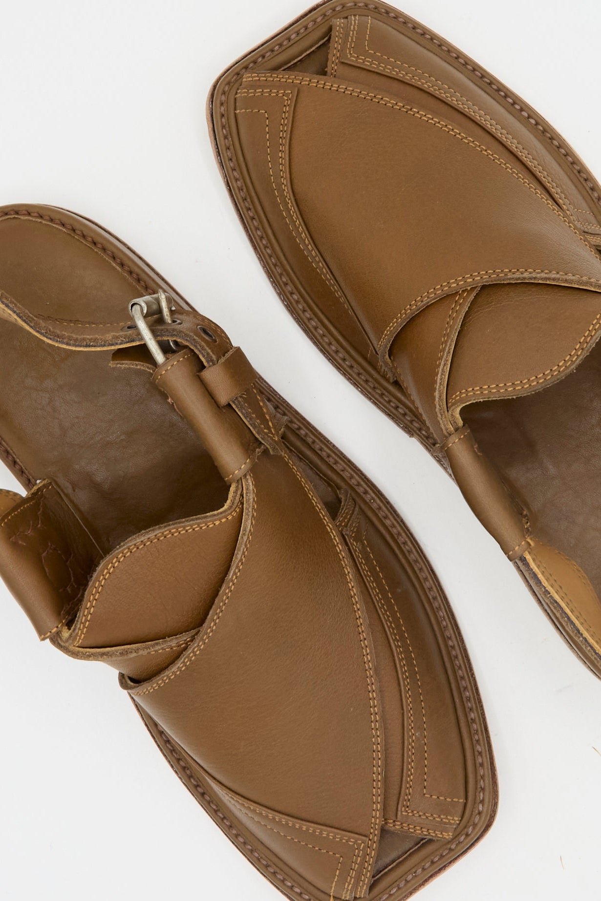 The Bless No. 08 Desertsandals in Dark Brown feature stitched leather, a metal buckle, and are showcased on a white background.