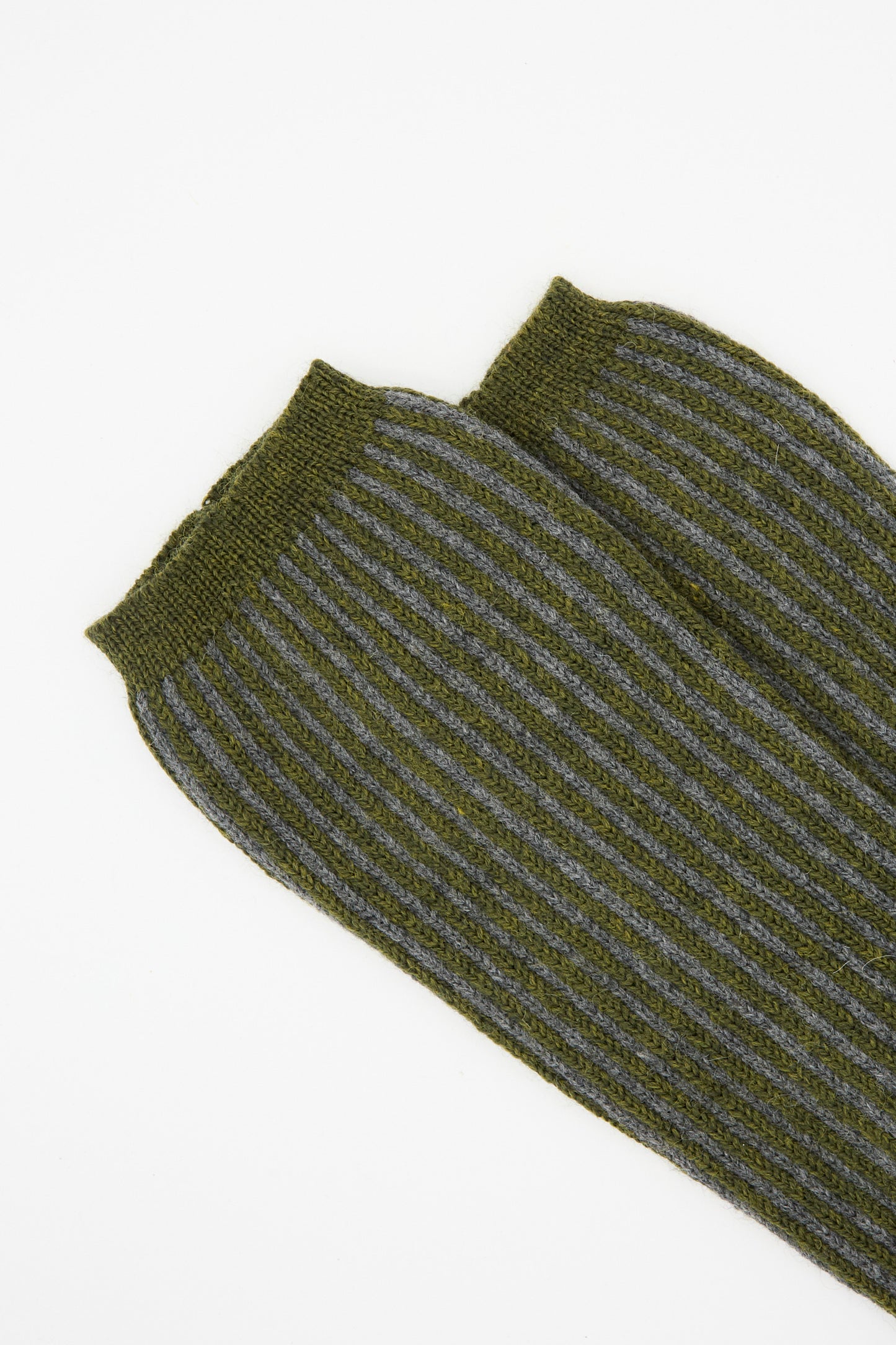 Close-up of Cawley's British Merino Wool Sock in Moss and Slate Stripe, made in London, showing olive green with gray stripes, laid side by side on a white background.
