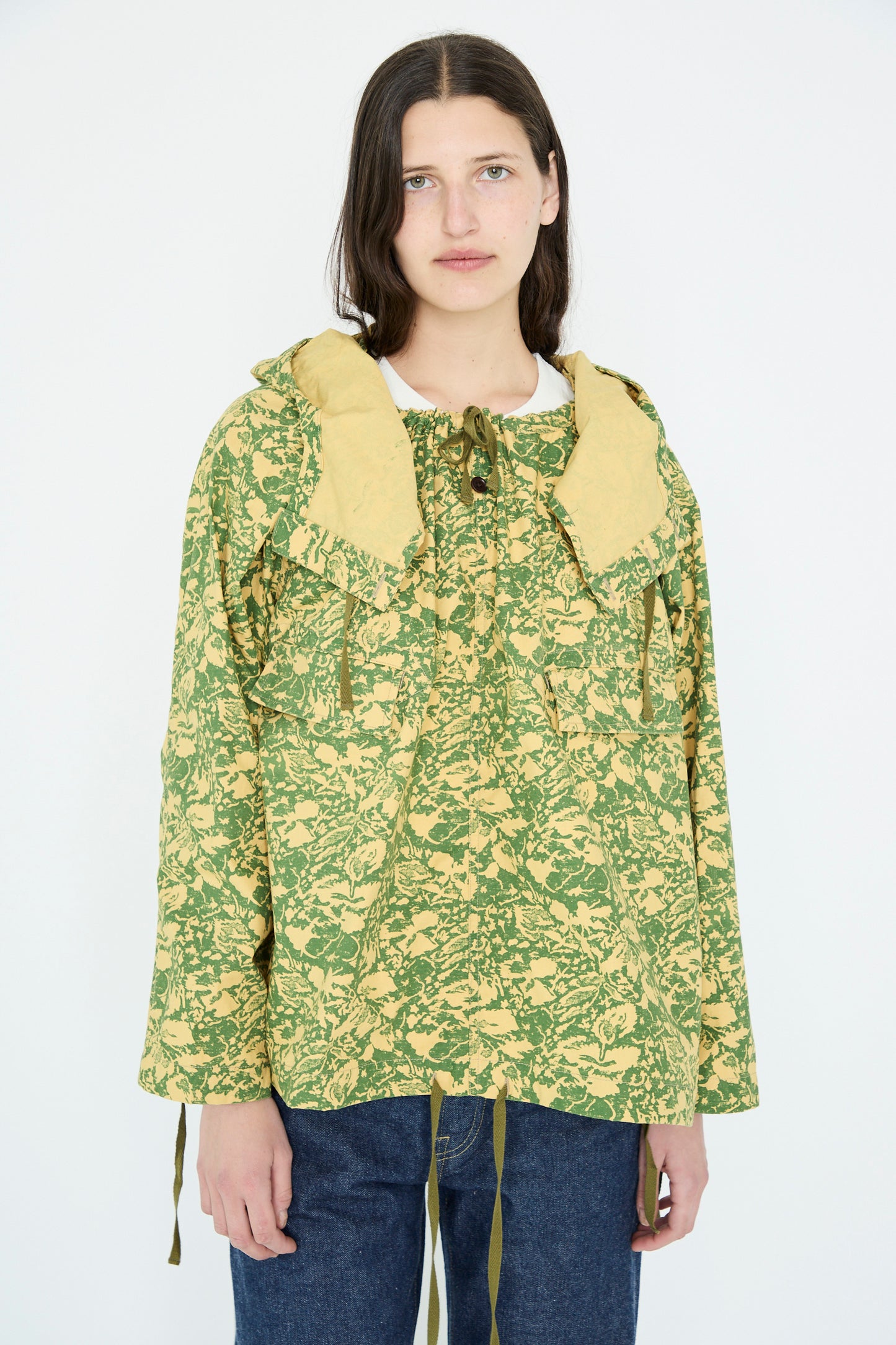 Wearing Chimala's Summer Leaf Smock Jacket in Camo, a person stands against a plain background.