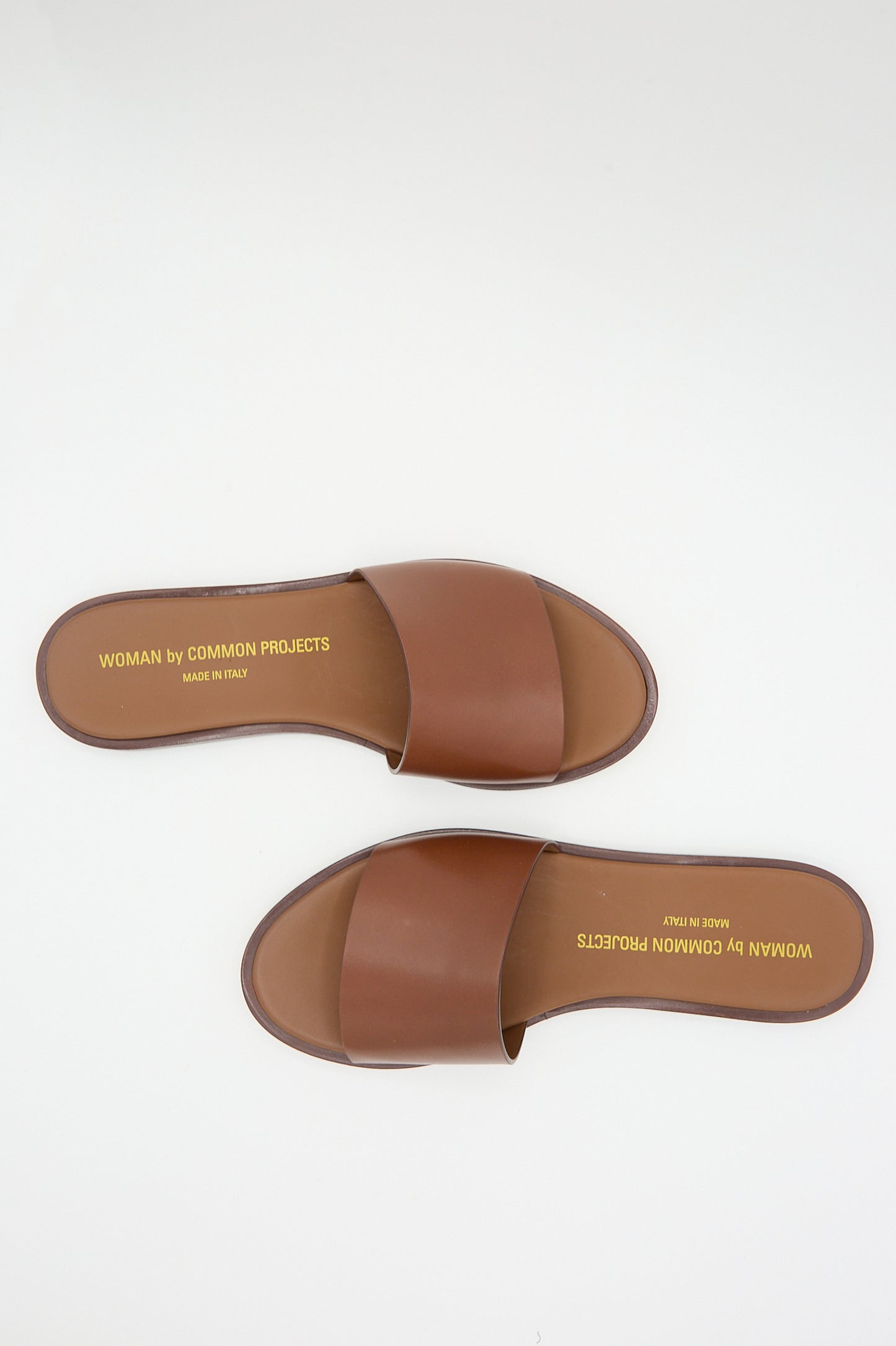 Brown Nappa leather slide sandals displayed against a white background.
becomes
Common Projects Leather Slide 6155 Sandal in Brown displayed against a white background.