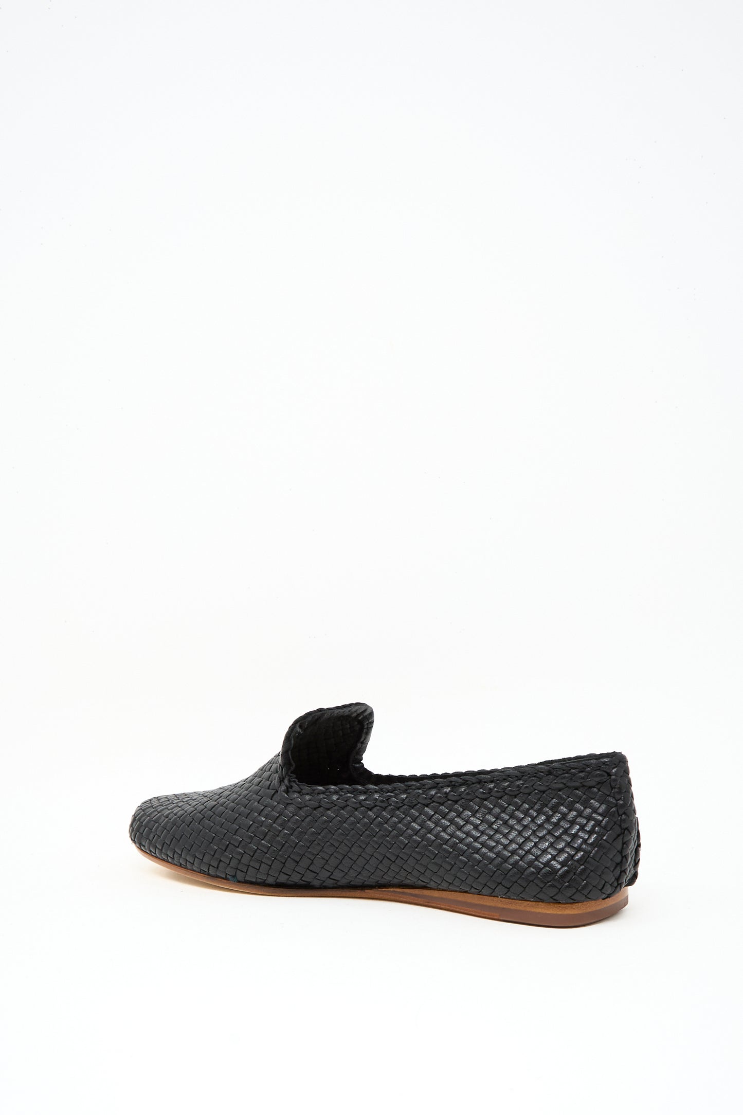 The Dragon Diffusion Damas Slipper in Black, featuring handwoven leather and a brown sole, is shown against a plain white background.