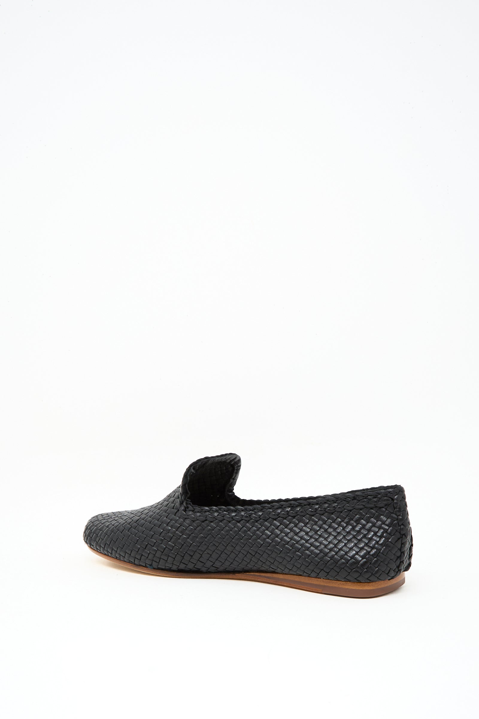 The Dragon Diffusion Damas Slipper in Black, featuring handwoven leather and a brown sole, is shown against a plain white background.