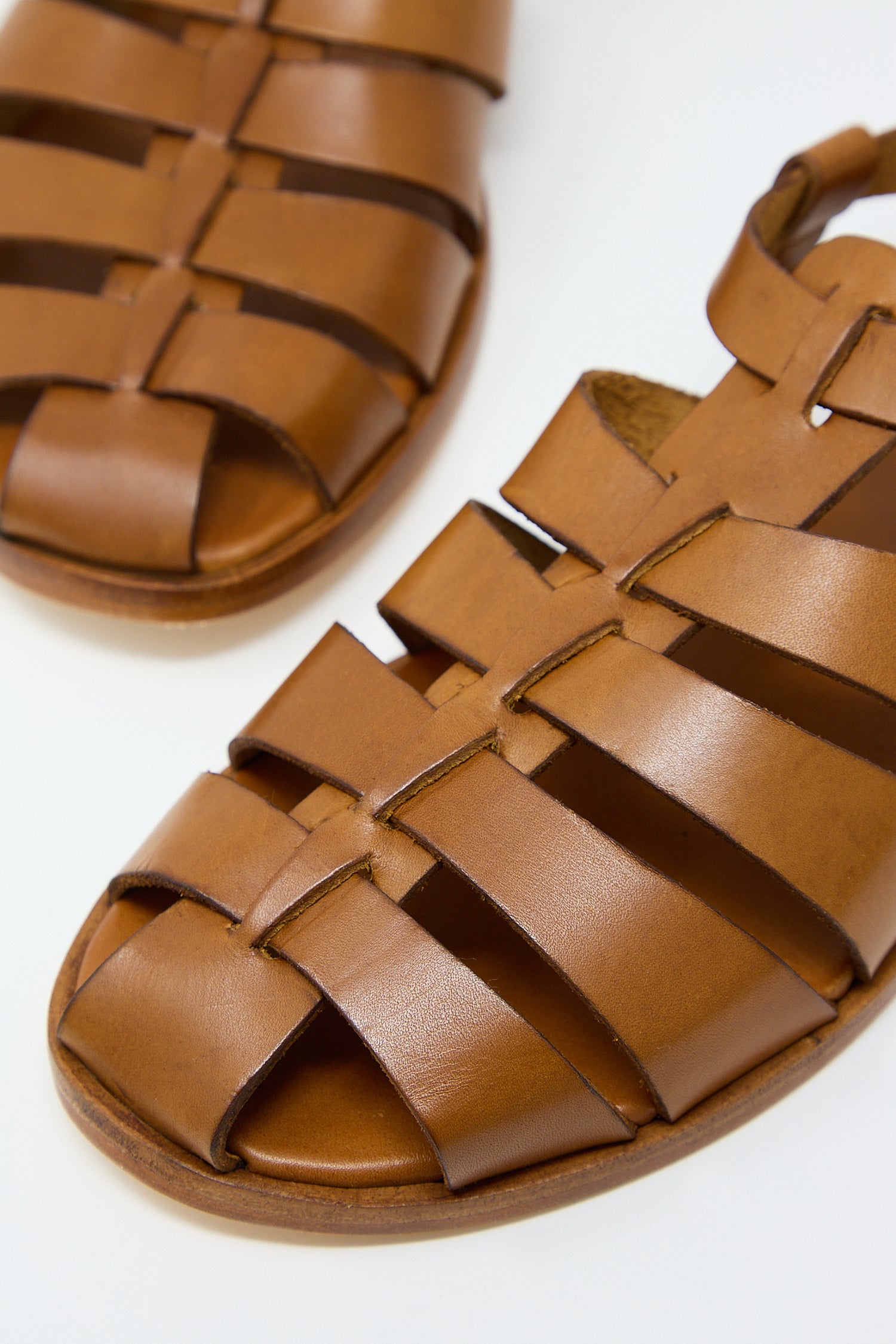 A pair of Dragon Diffusion Pescador Sandal in Tan against a white background.