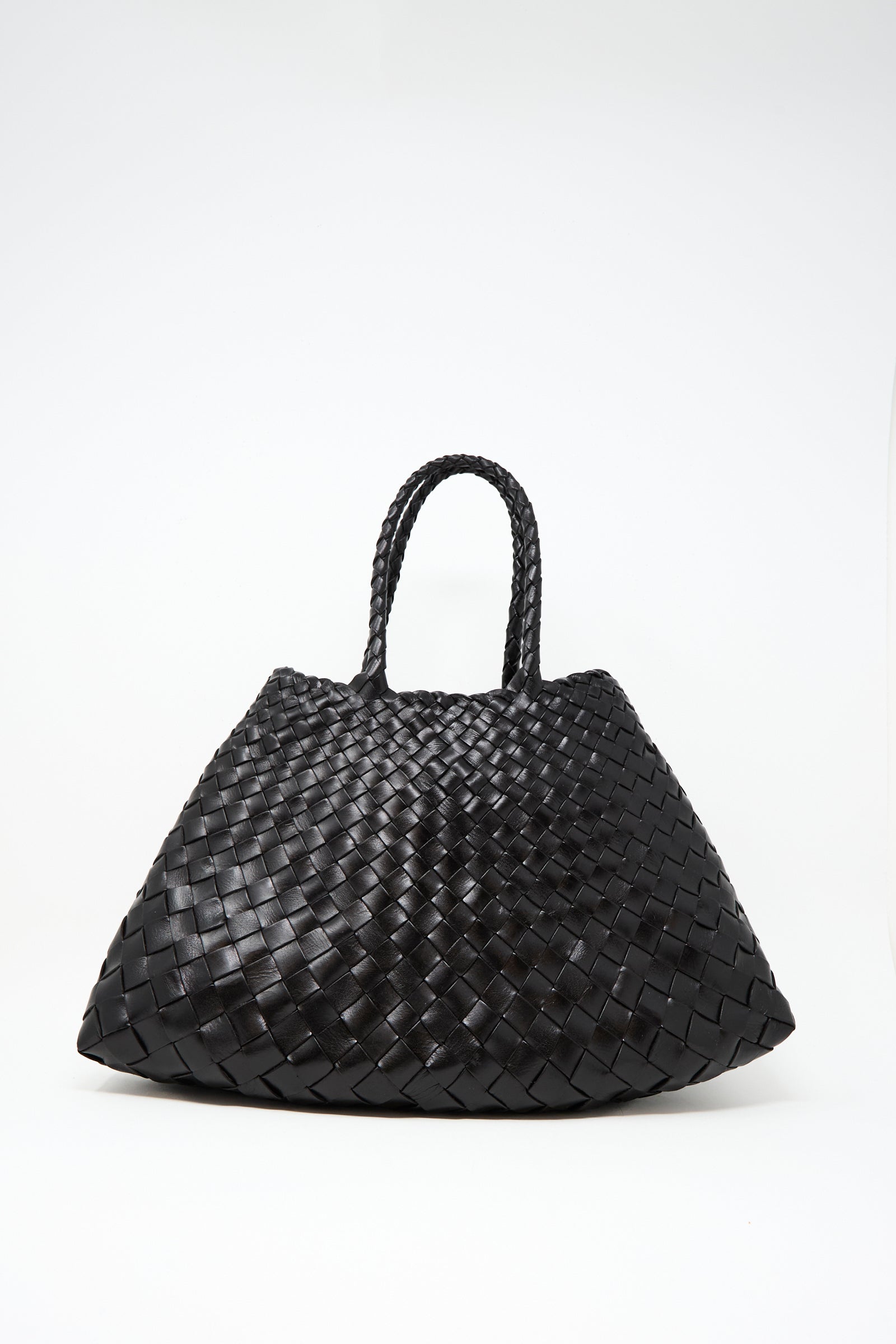 The Dragon Diffusion Santa Croce Small in Black is a handwoven leather handbag with braided handles and two sturdy straps, shown against a plain white background.
