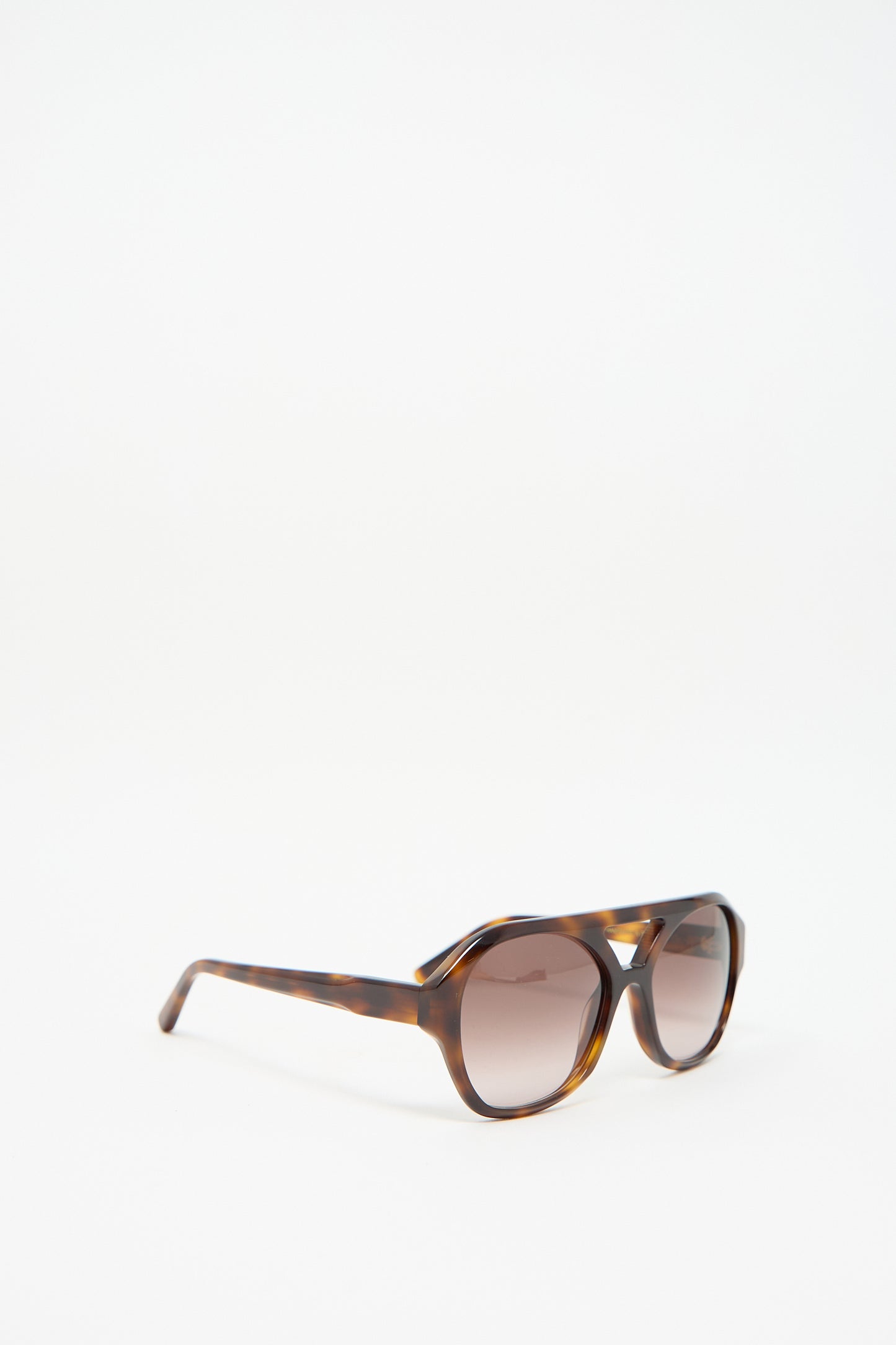 Eva Masaki's Chiyo Sunglasses in Good Luck boast Italian acetate construction with tortoiseshell round frames and gradient lenses, delivering 100% UV protection for a chic and secure style.