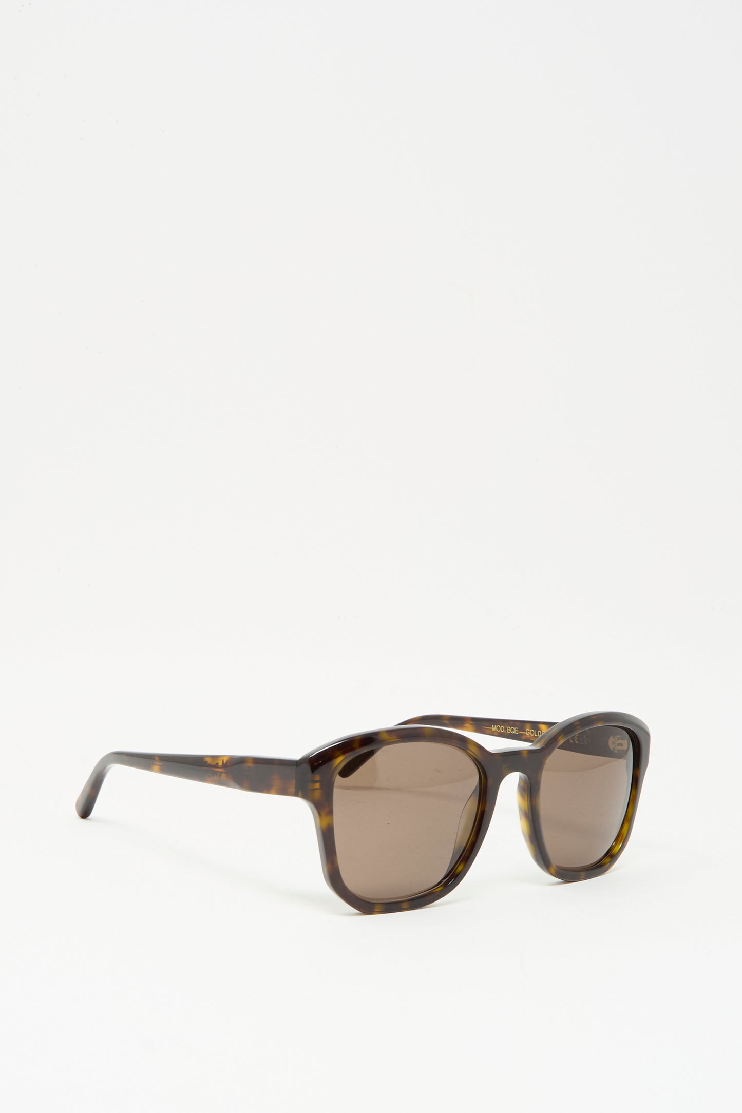 A pair of Eva Masaki BQE Sunglasses in Finch, featuring an oversized Havana tortoise shell frame and dark lenses with 100% UV protection, displayed on a plain white background.