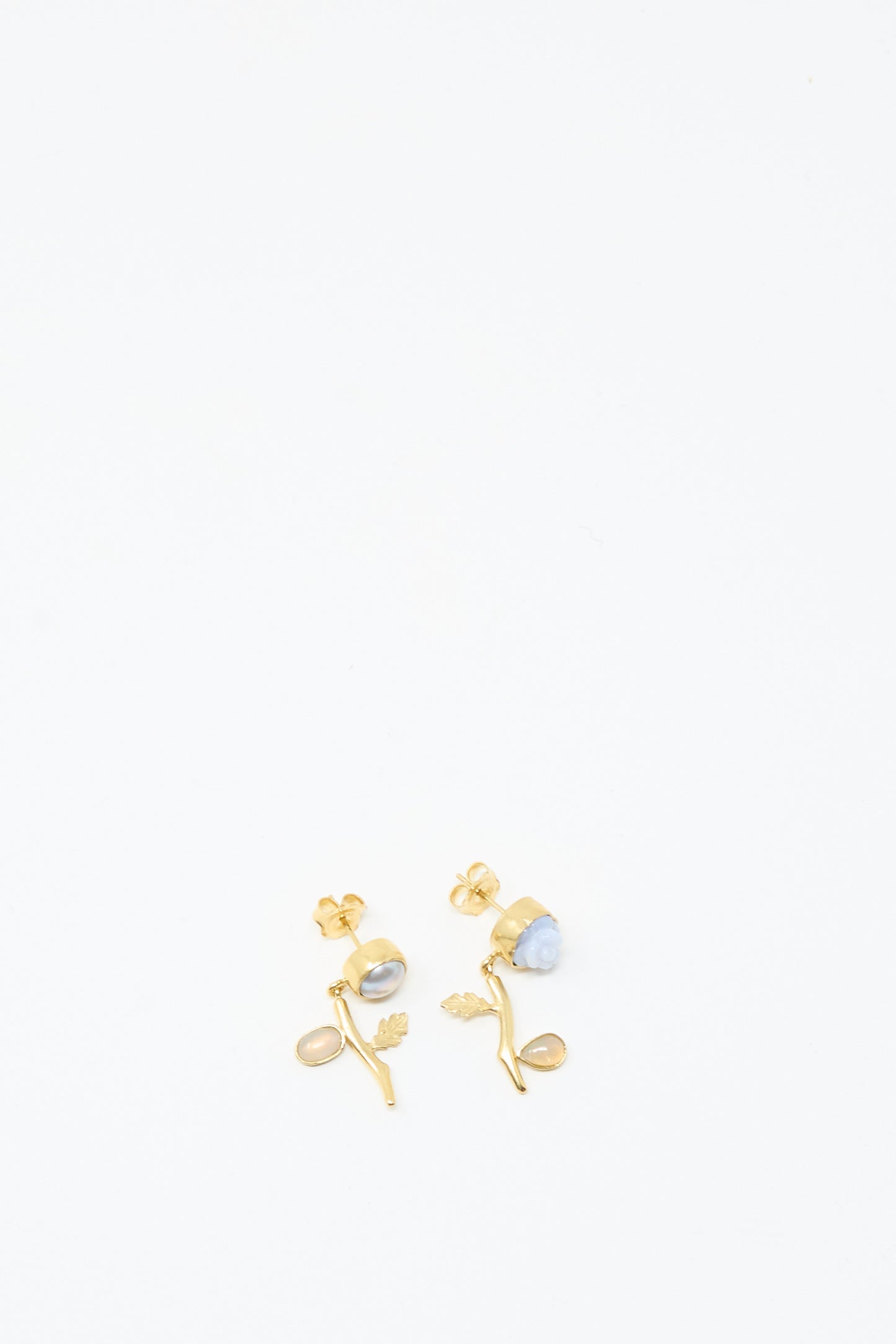 Flower Drop Earrings by Grainne Morton: handmade 18K gold plated silver studs with branch and leaf motifs, adorned with round and oval gemstones, showcased on a white background.