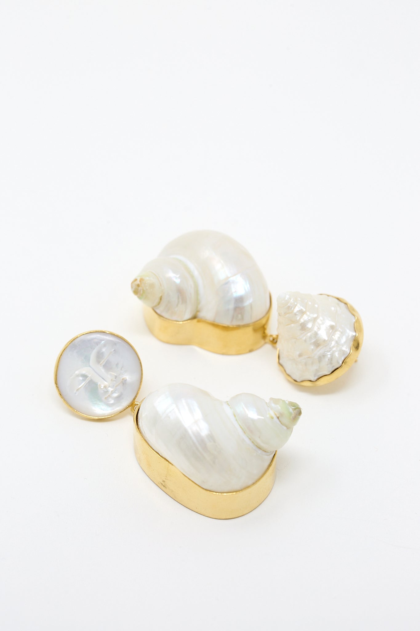 A pair of Grainne Morton Moon and Star Shell Drop Earrings in 18K gold-plated silver on a white surface.