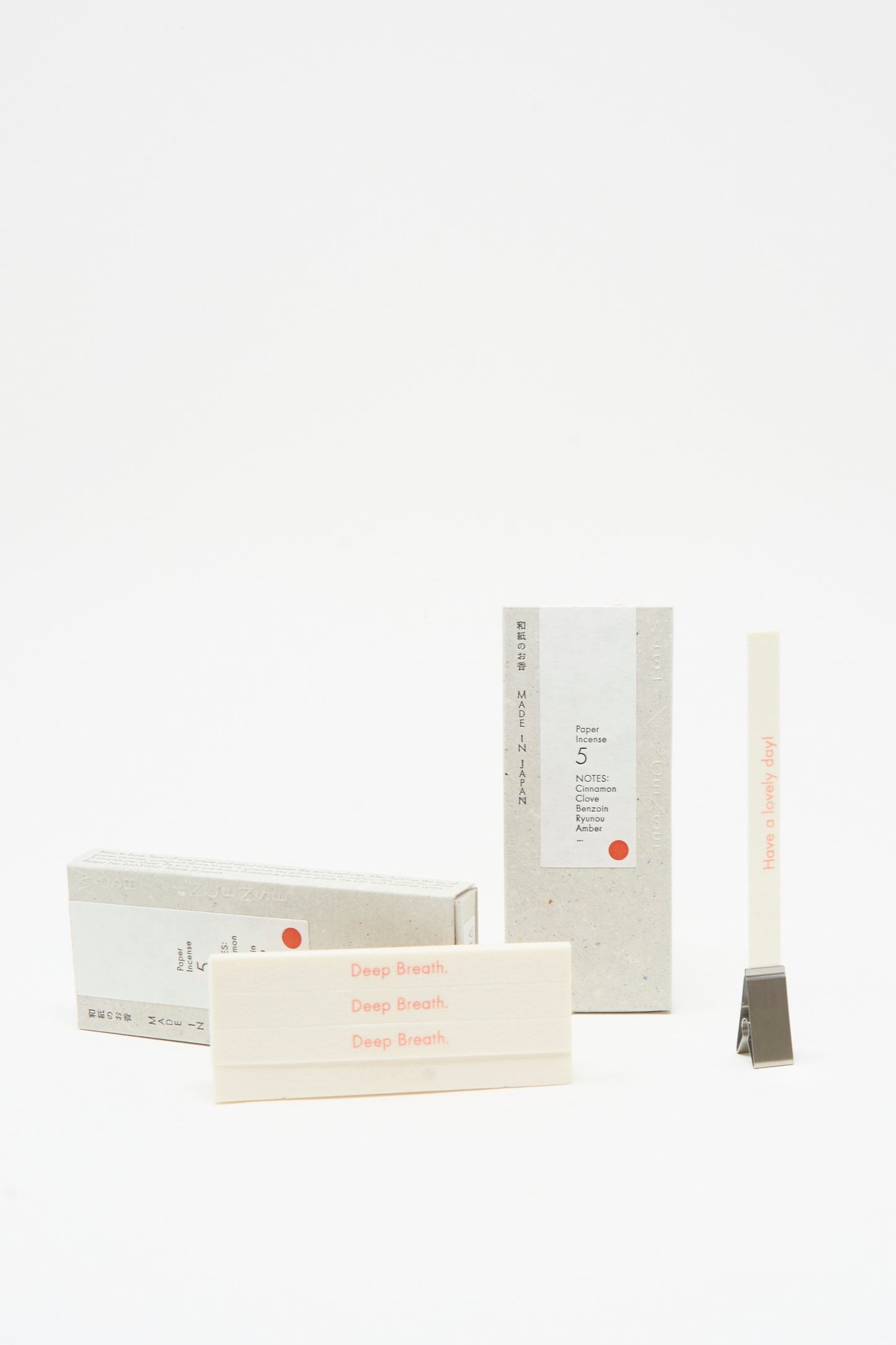 Morihata’s Washi Paper Incense Strips in Smoky Comfort come with a minimal holder and refined packaging labeled "Deep Breath," all set against a clean white background. Crafted in Japan for an elegant, minimalist touch.