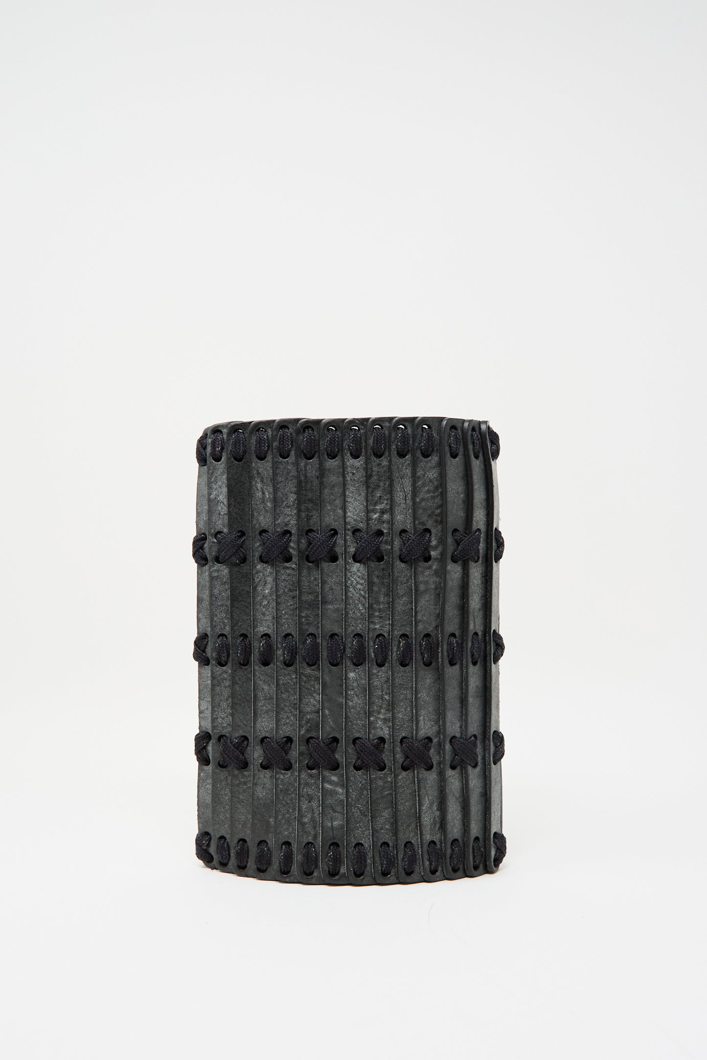 The Hatori Leather Phone 26 Bag features a rectangular shape in waxed coated black leather with indigo lace, handcrafted in Tokyo, and displayed against a plain white background.