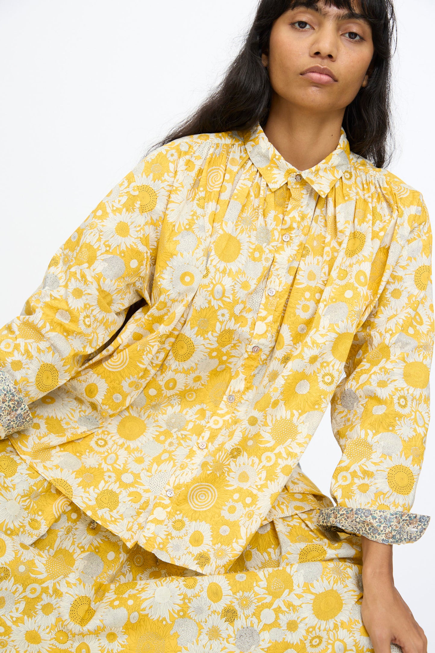 A person in the Ichi Antiquités Cotton Liberty Shirt in Yellow sits against a plain background, looking toward the camera.