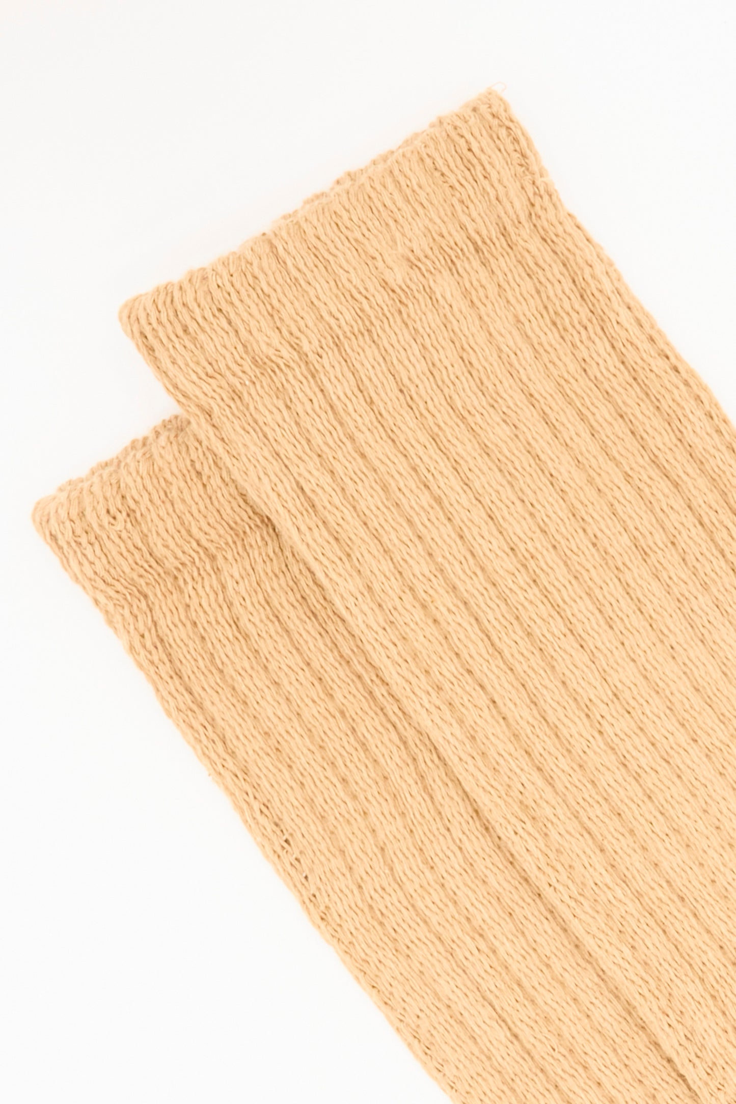 A close-up of two overlapping Cotton Rib Socks in Camel by Ichi Antiquités, showcasing their ribbed knit texture against a white background.