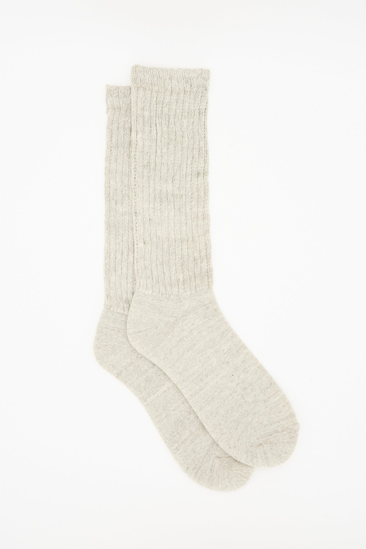 The Ichi Antiquités Cotton Rib Sock in Grey is a light gray, ribbed cotton sock from Japan, shown laid flat on a white background.