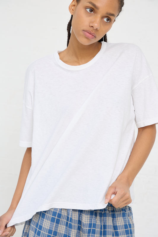 Woman in a white oversized Ichi Antiquités Cotton T-Shirt and plaid pants.