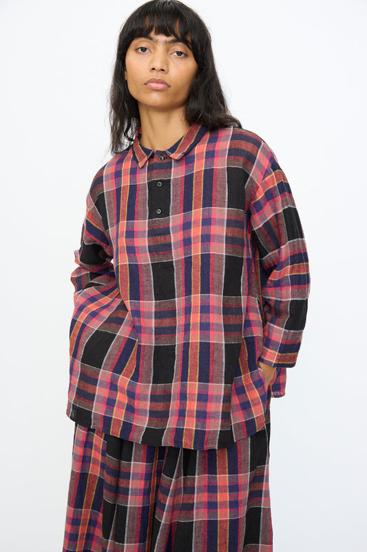 A person wearing the Ichi Antiquités Linen Cotton Check Shirt in Black, styled with a matching plaid skirt, stands against a plain white background.