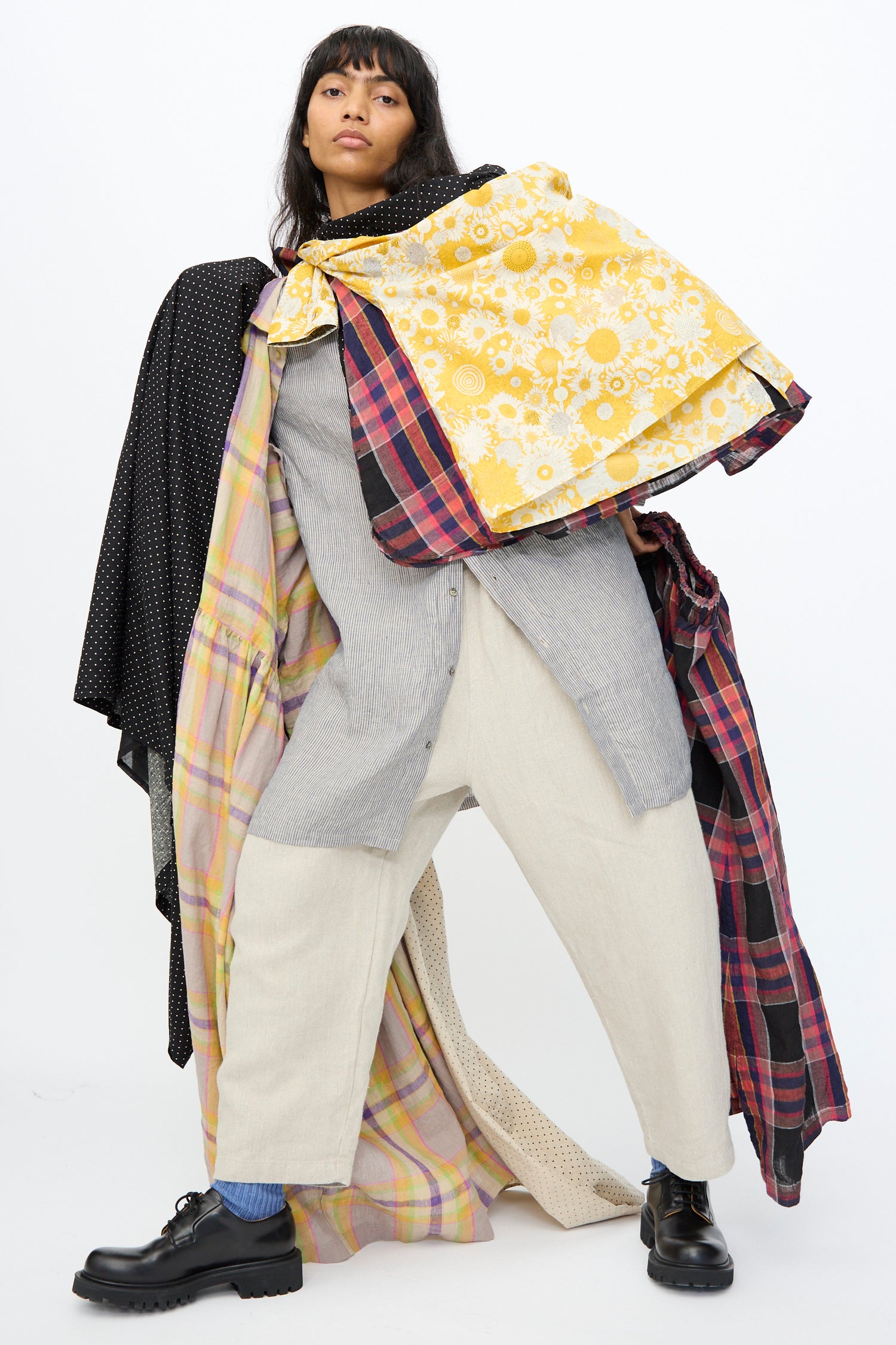 A woman wearing a layers of the new Ichi Antiquités Prefall collection on a white background.