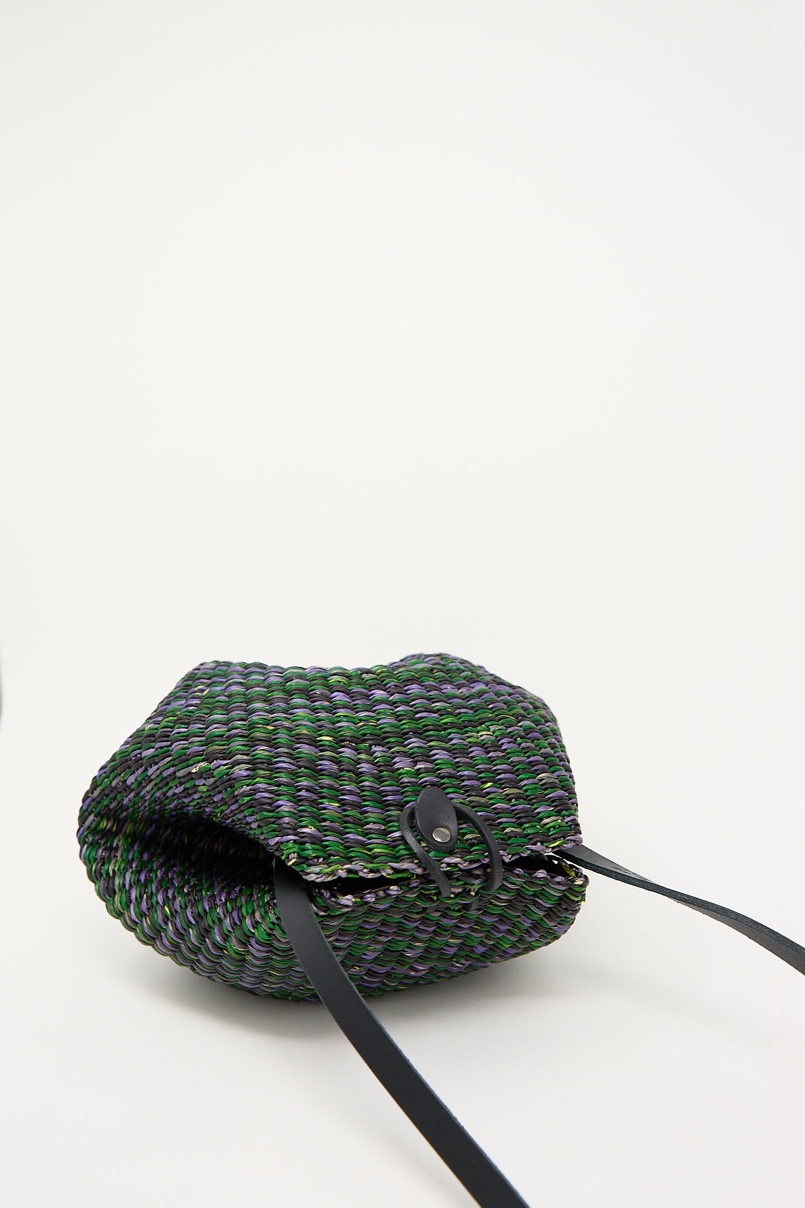 Woven N. 14 Mini Shell Bag in Green vegetable-tanned leather shoulder bag on a white background by Inès Bressand.