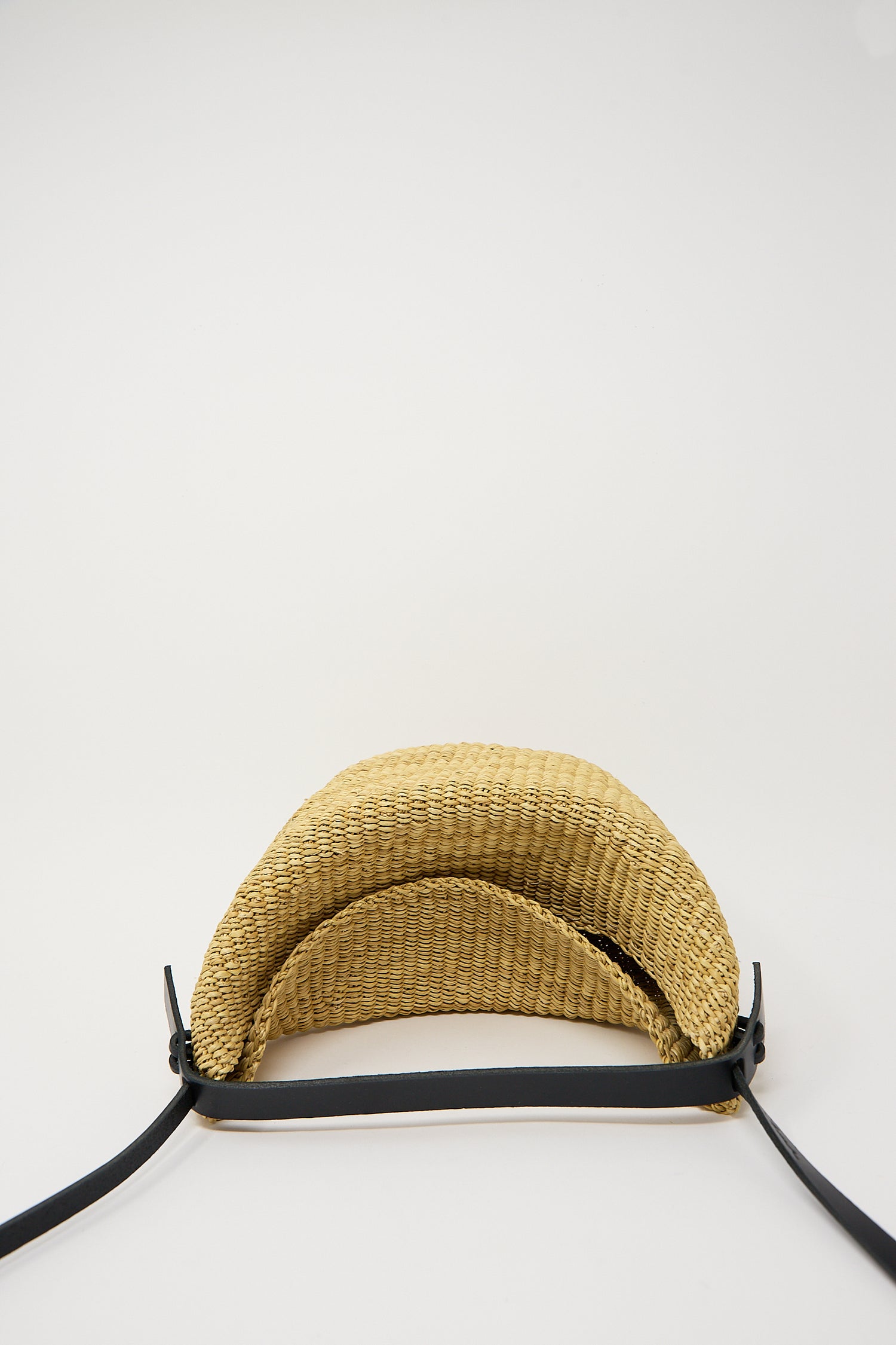 Straw sun visor cap made of elephant grass on a white background.