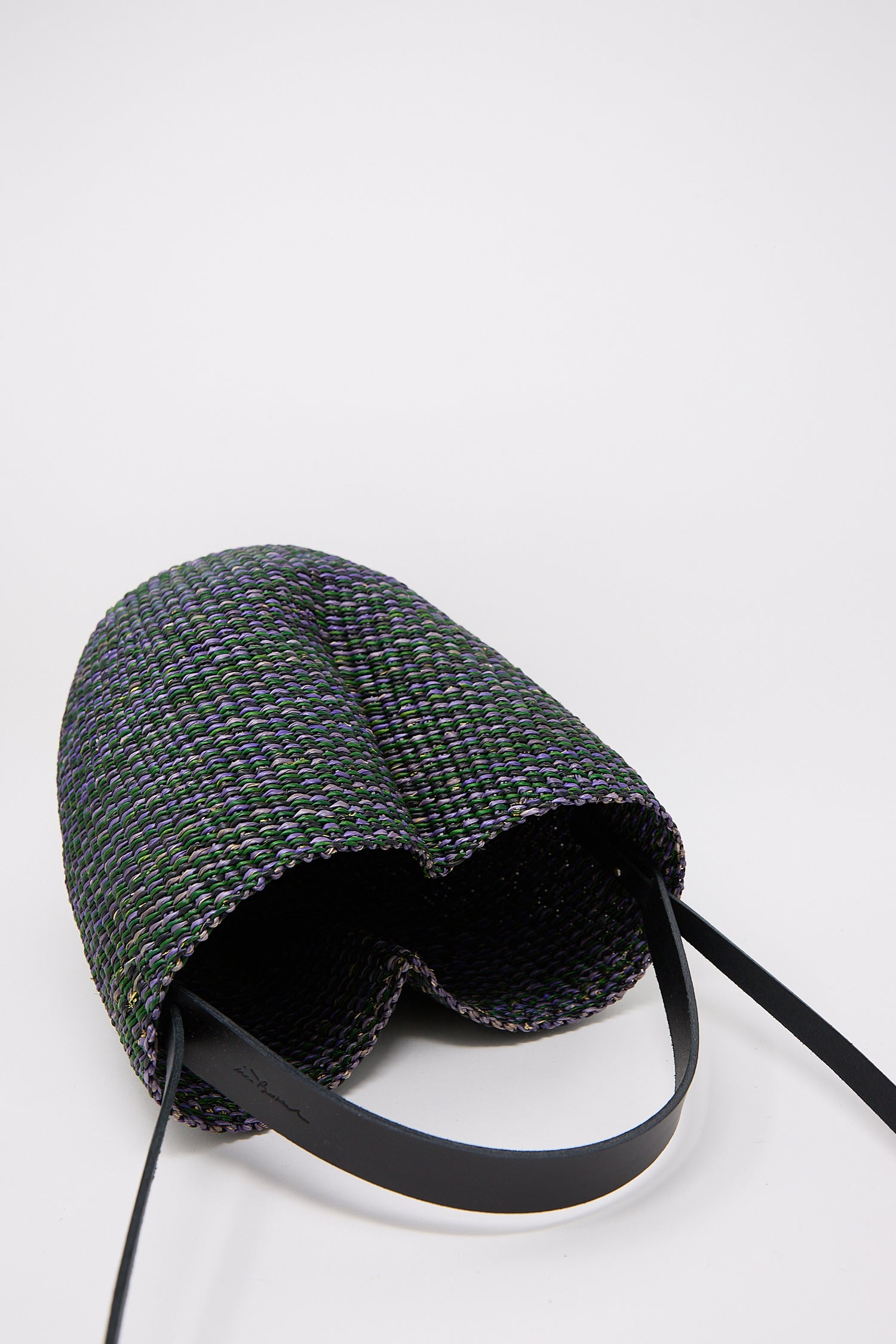 A N. 36 Haricot Bag in Green by Inès Bressand with a black strap on a white background.