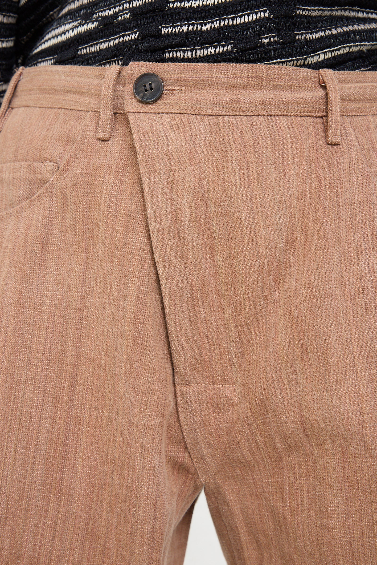 The front of a model Cotton Denim Oversized Trouser in Kakishibu by Jan-Jan Van Essche.