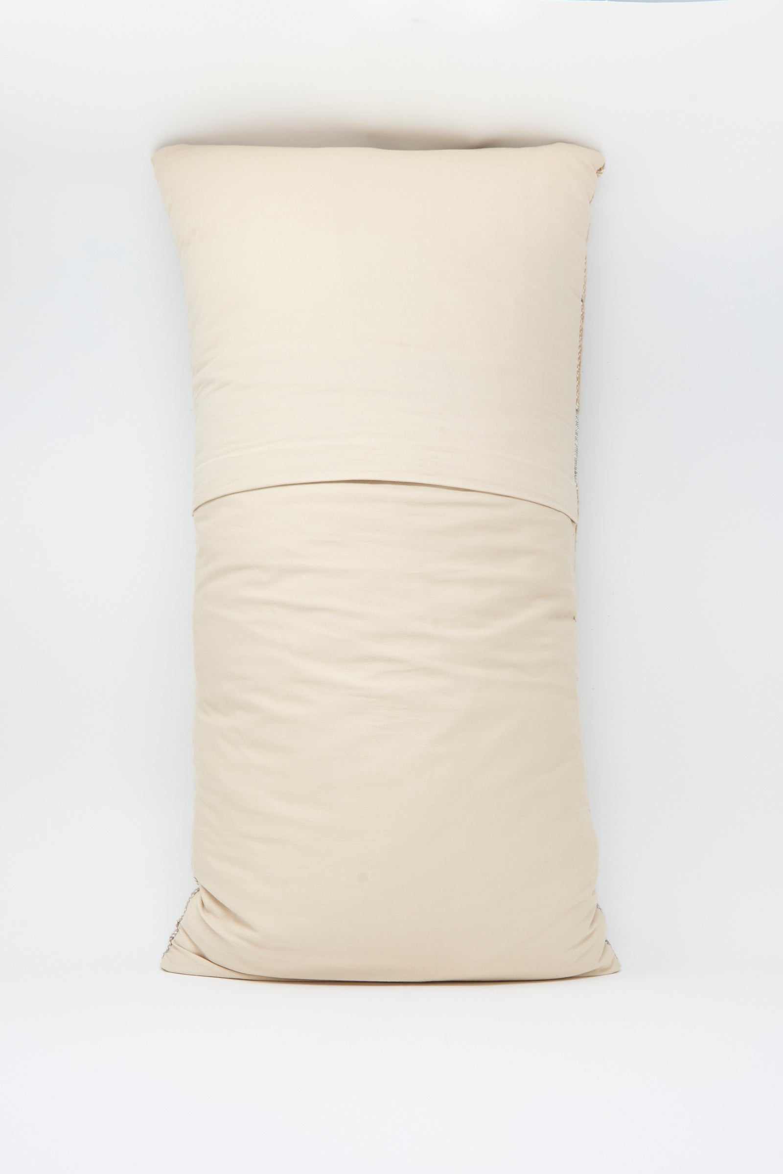 The Woven Pillow in Blush and Silver by Jess Feury features a rectangular handwoven design with subtle wrinkles, handmade in California and shown against a plain white background.