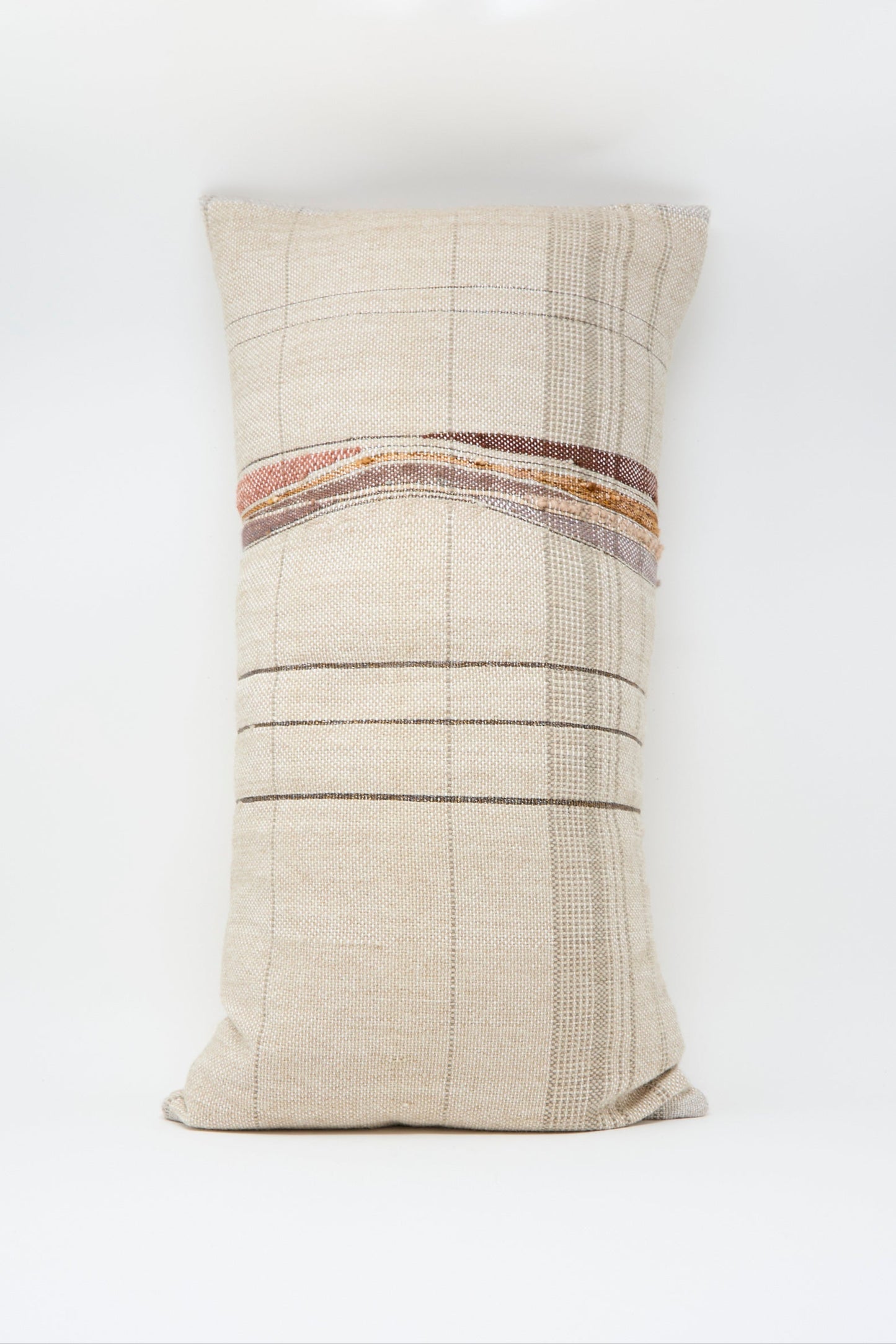The Jess Feury Woven Pillow in Taupe and Multi features a rectangular, beige handwoven design with plaid patterns and horizontal brown and tan stripes, crafted from sustainable fibers against a plain white background.