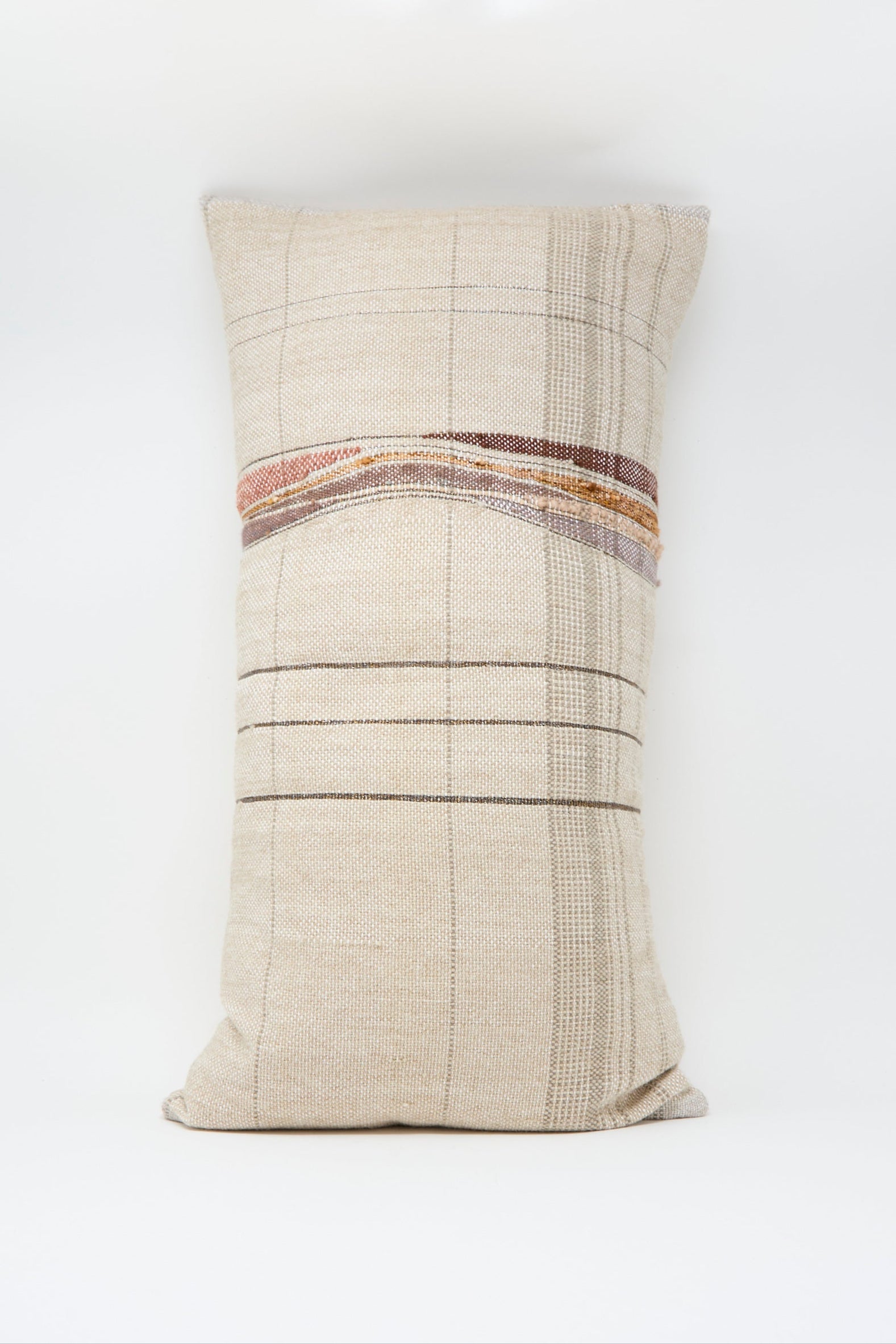 The Jess Feury Woven Pillow in Taupe and Multi features a rectangular, beige handwoven design with plaid patterns and horizontal brown and tan stripes, crafted from sustainable fibers against a plain white background.