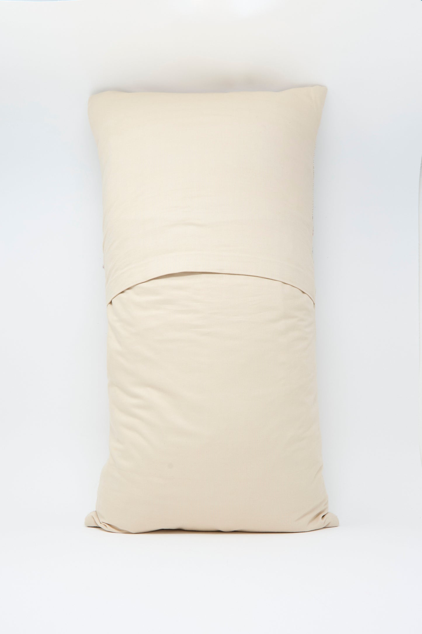 The Jess Feury Woven Pillow in Taupe and Multi, paired with a matching pillowcase, rests on a white surface, centered against a plain white background.