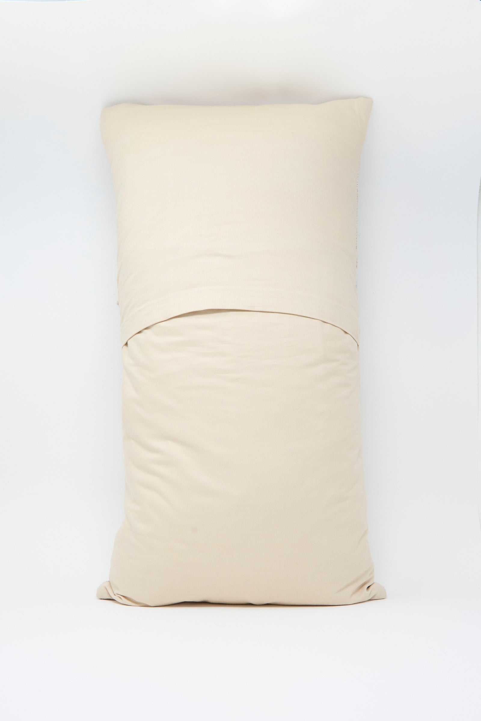 The Jess Feury Woven Pillow in Taupe and Multi, paired with a matching pillowcase, rests on a white surface, centered against a plain white background.