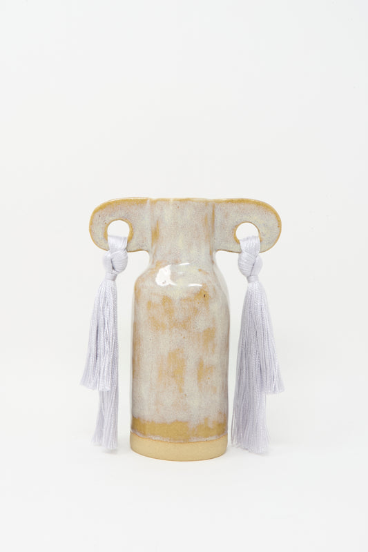 The Karen Tinney Vase #606 in Gray is a petite handmade stoneware vase from Vermont, featuring two wide handles with gray tencel fringe against a plain white background.