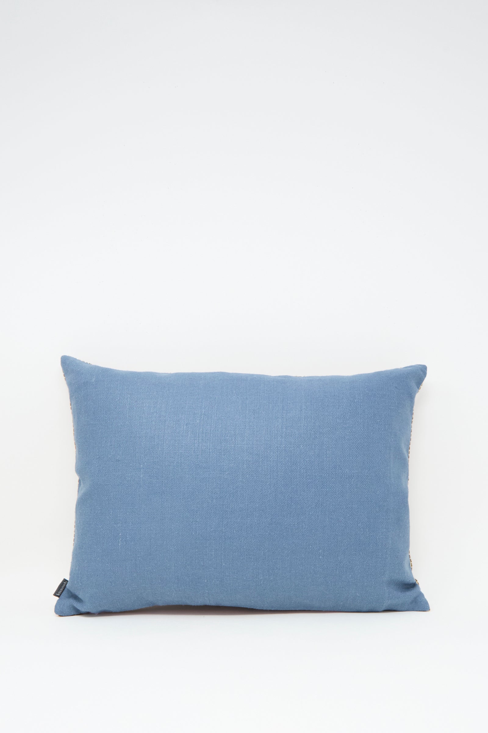 The Rana Hand Embroidered Pillow in Lilac and Cognac by Kissweh is displayed against a white background.