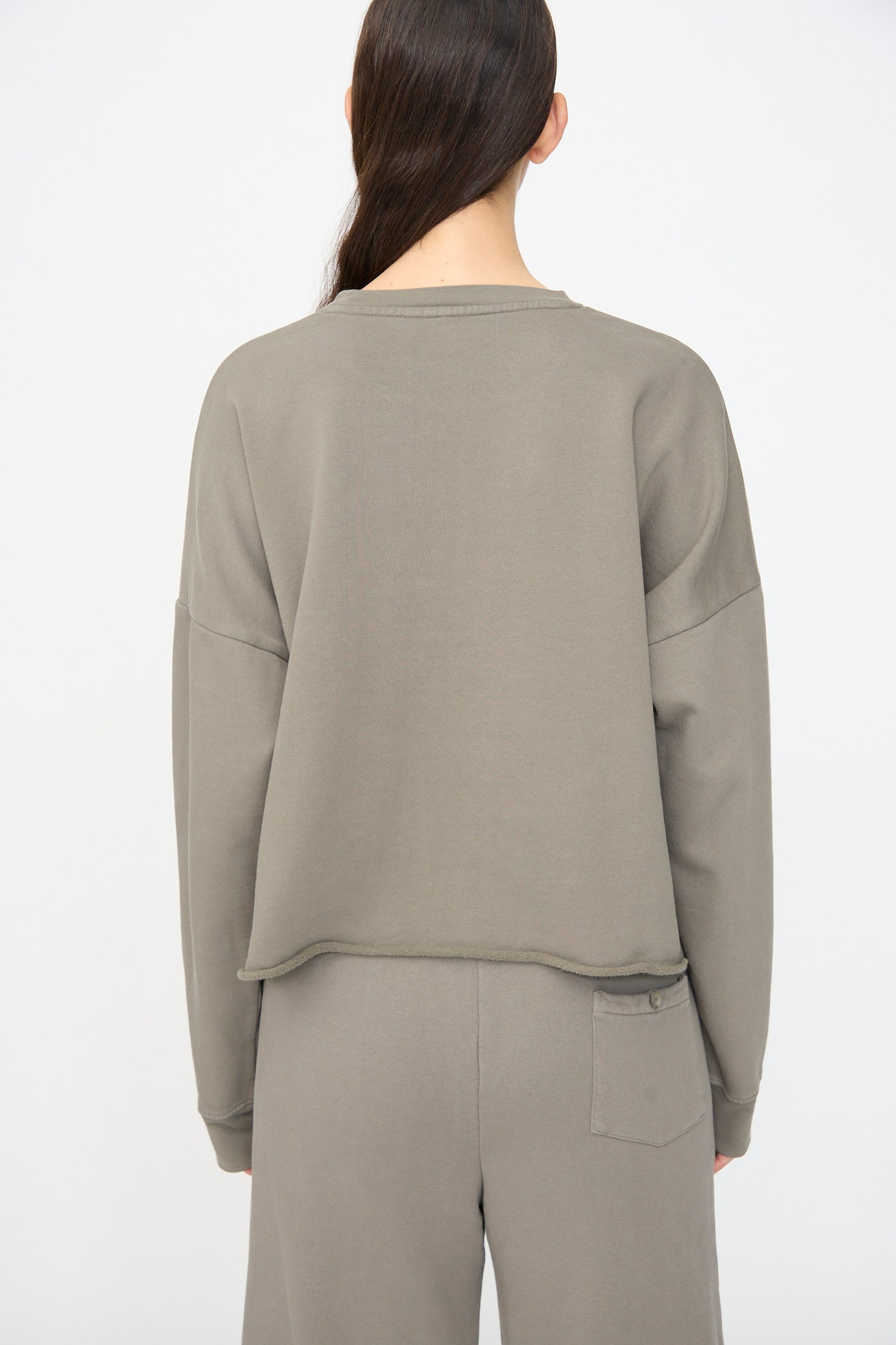Person wearing the Lauren Manoogian Fleece Crewneck in Fatigue, shown from the back against a plain white background.