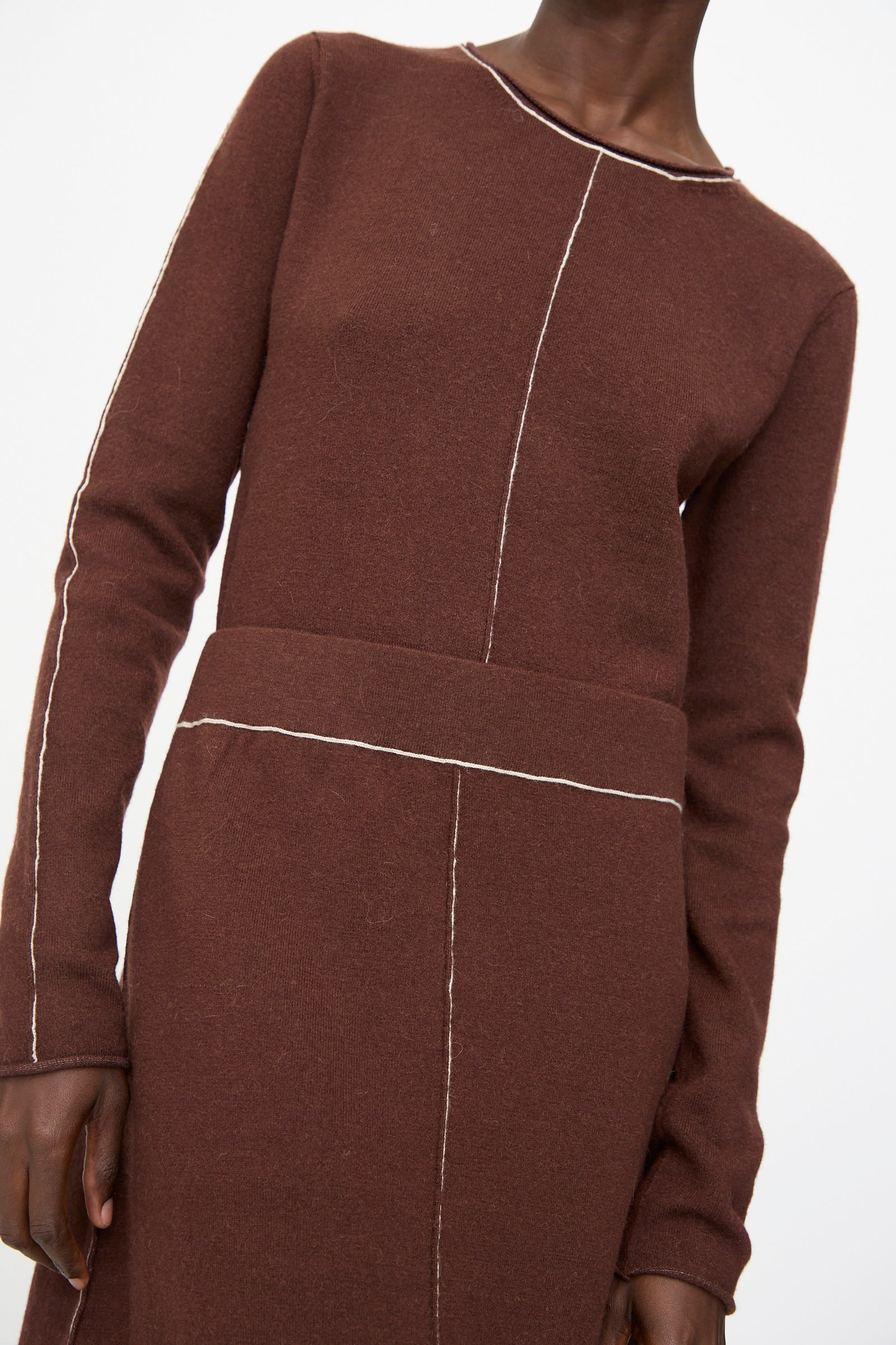 Model wears the Lauren Manoogian Stitch Skirt in Merlot, featuring visible white seam stitching, shown from shoulders to upper thigh.