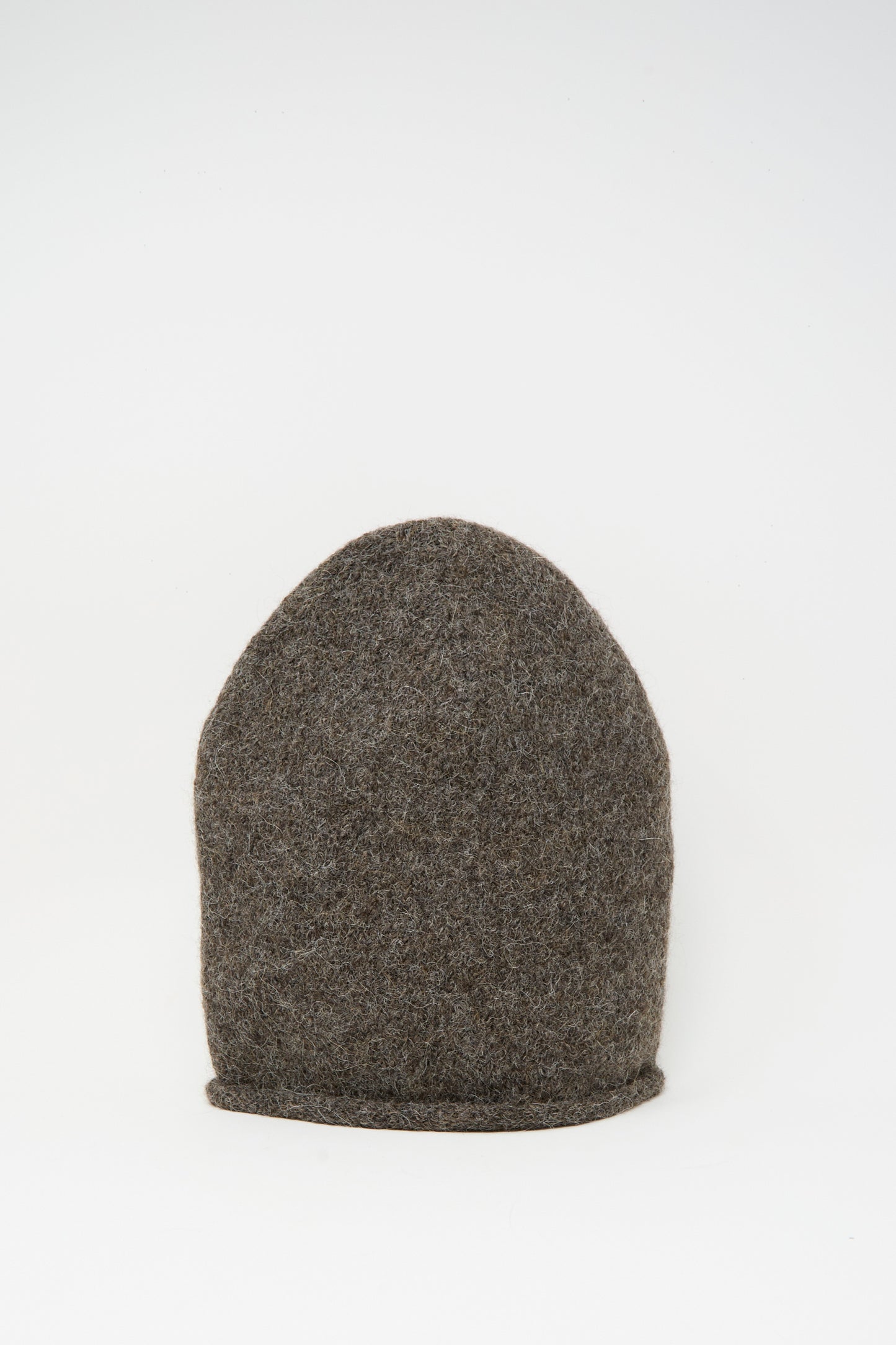 The Lauren Manoogian Crown Beanie in Patina, a brown, dome-shaped hat made from a cozy knit alpaca blend, is shown against a plain white background.