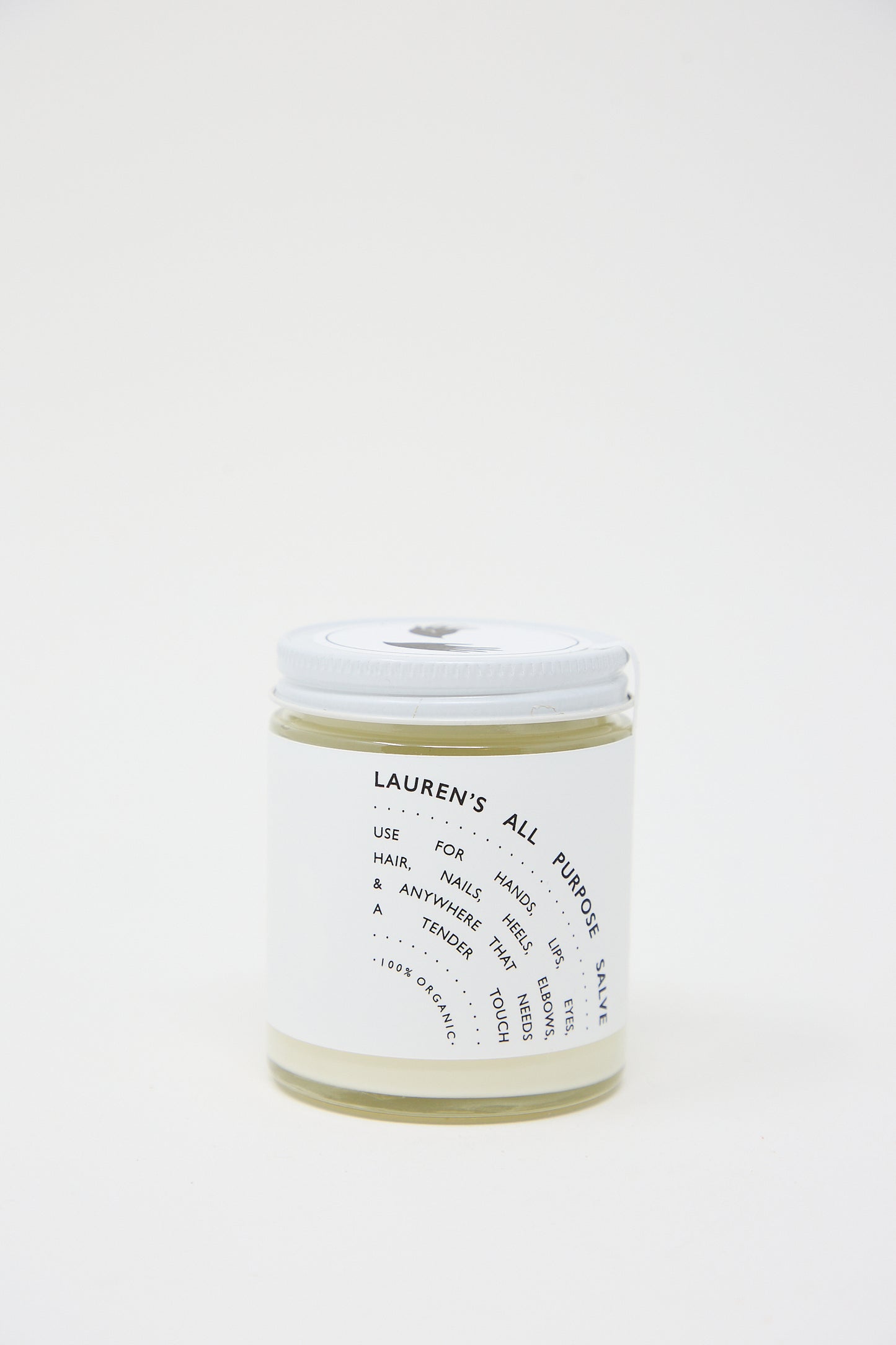 A clear jar labeled "Lauren's All Purpose Salve" from Lauren's All Purpose containing a creamy substance, set against a white background.