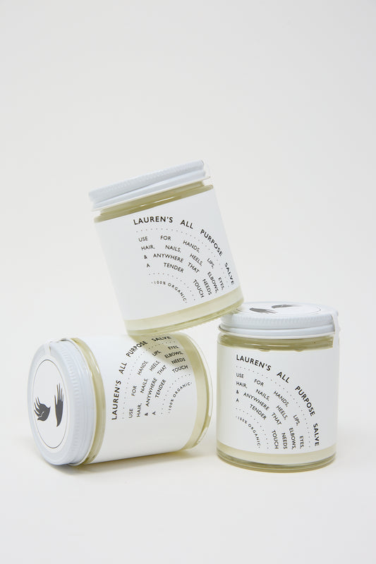 Three jars of "Lauren's All Purpose" salve with labels displaying organic ingredients and usage instructions, arranged against a white background.