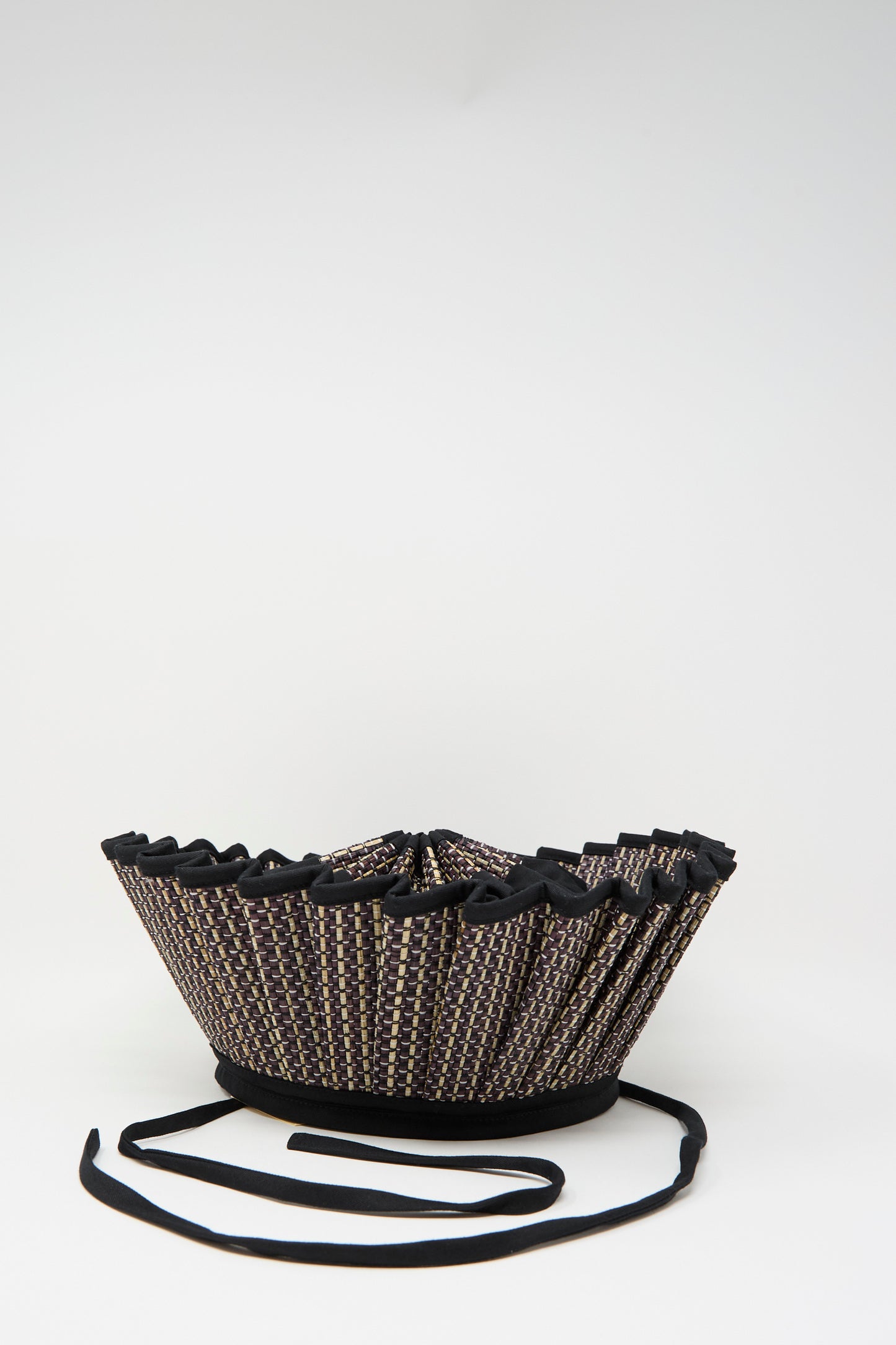 The Lorna Murray Melbourne Island Capri Maxi Hat features natural grass fibers with black trim and black straps, shown against a plain white background.