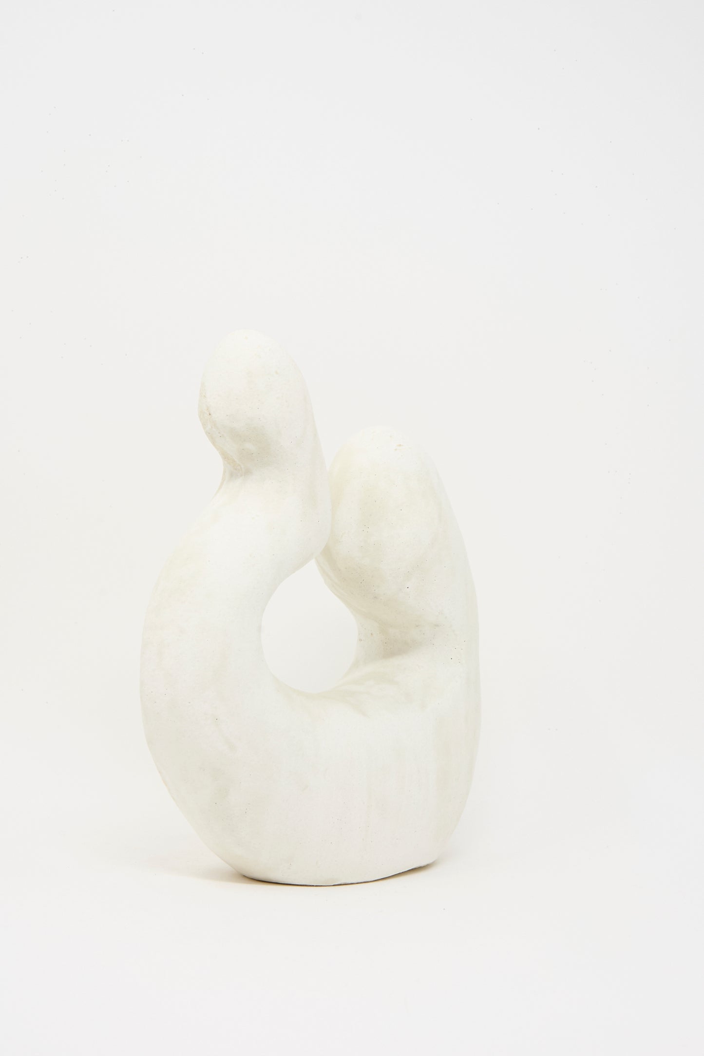 Hand Built Vessel No. 000980 by Lost Quarry is a white ceramic sculpture featuring smooth, curved organic forms and a subtly textured finish, displayed against a plain white background.