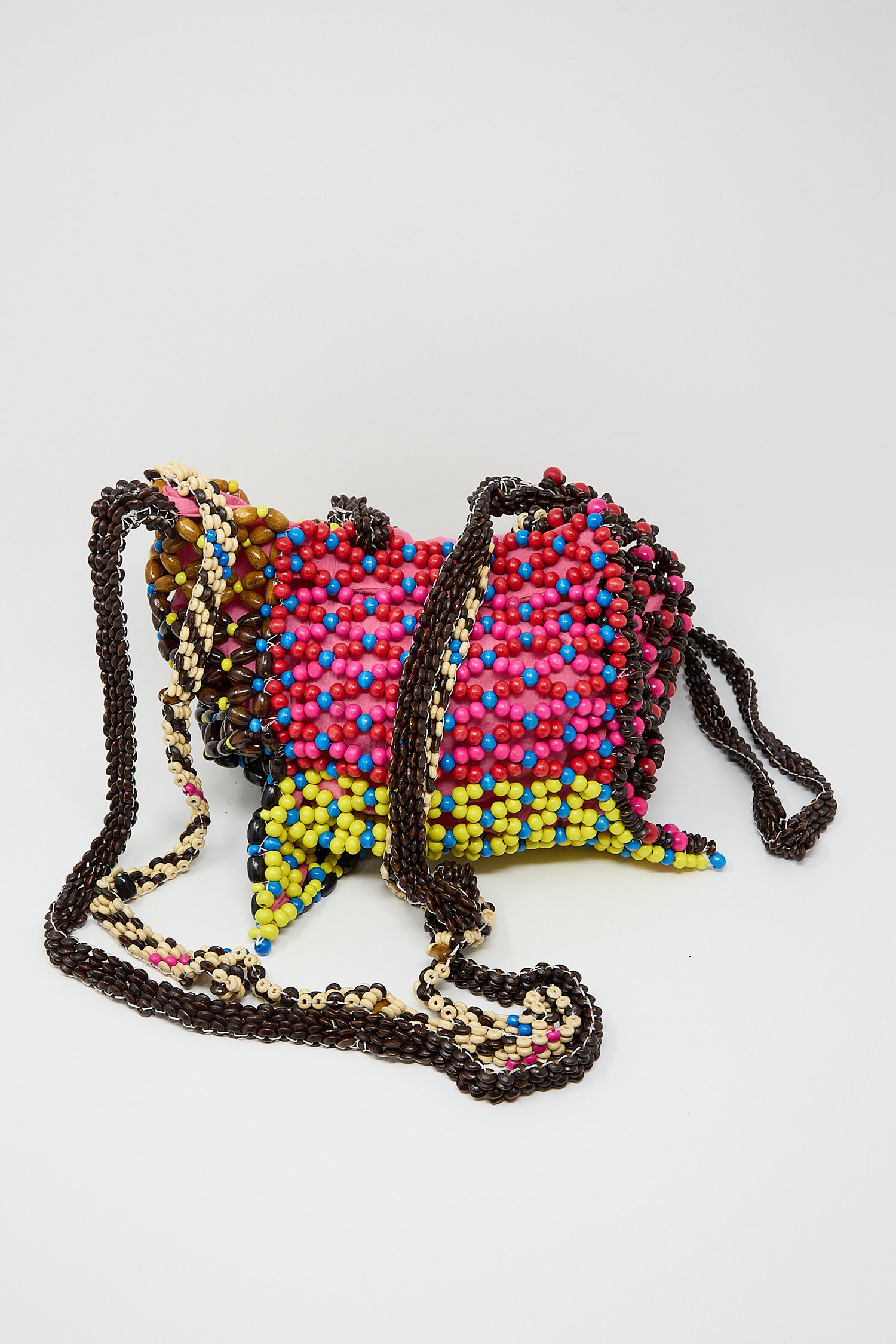 Colorful Assorted Beads Hectic Long Strap Bag in Multi Noise with a black strap against a white background by Luna Del Pinal.